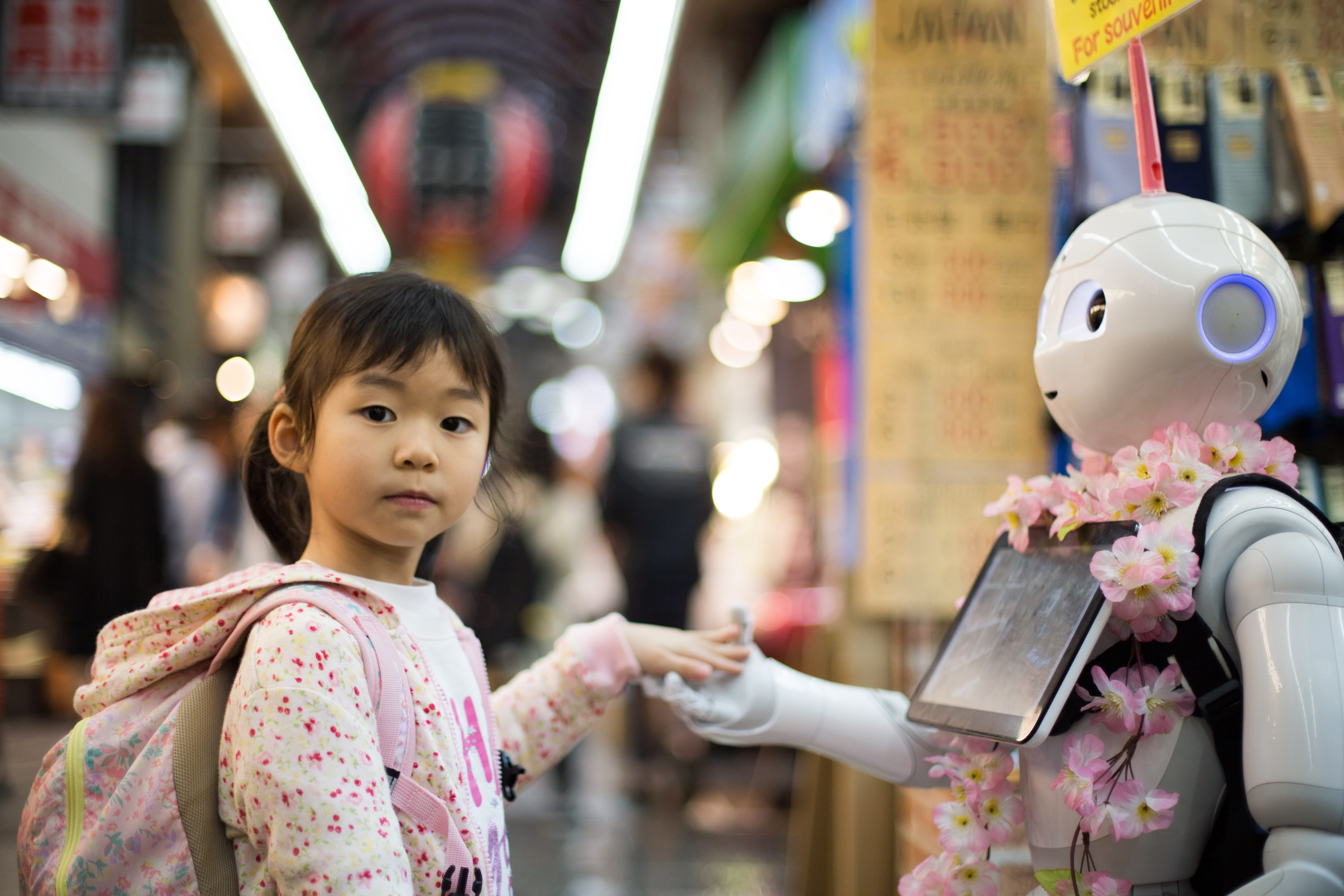 Young girl with humanoid robot