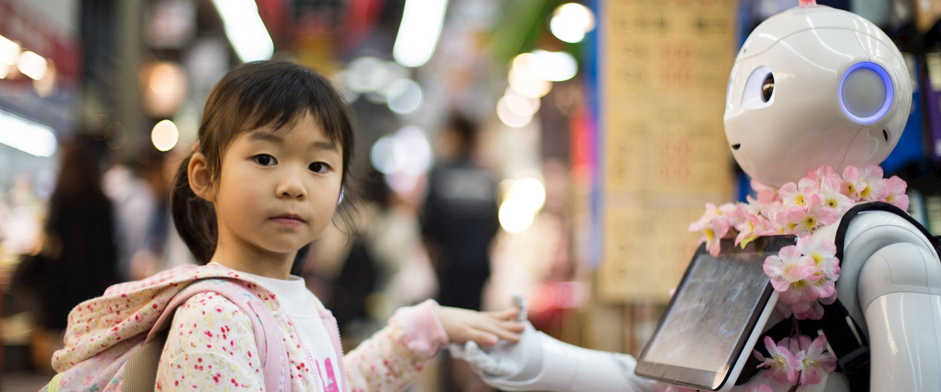 Young girl with humanoid robot