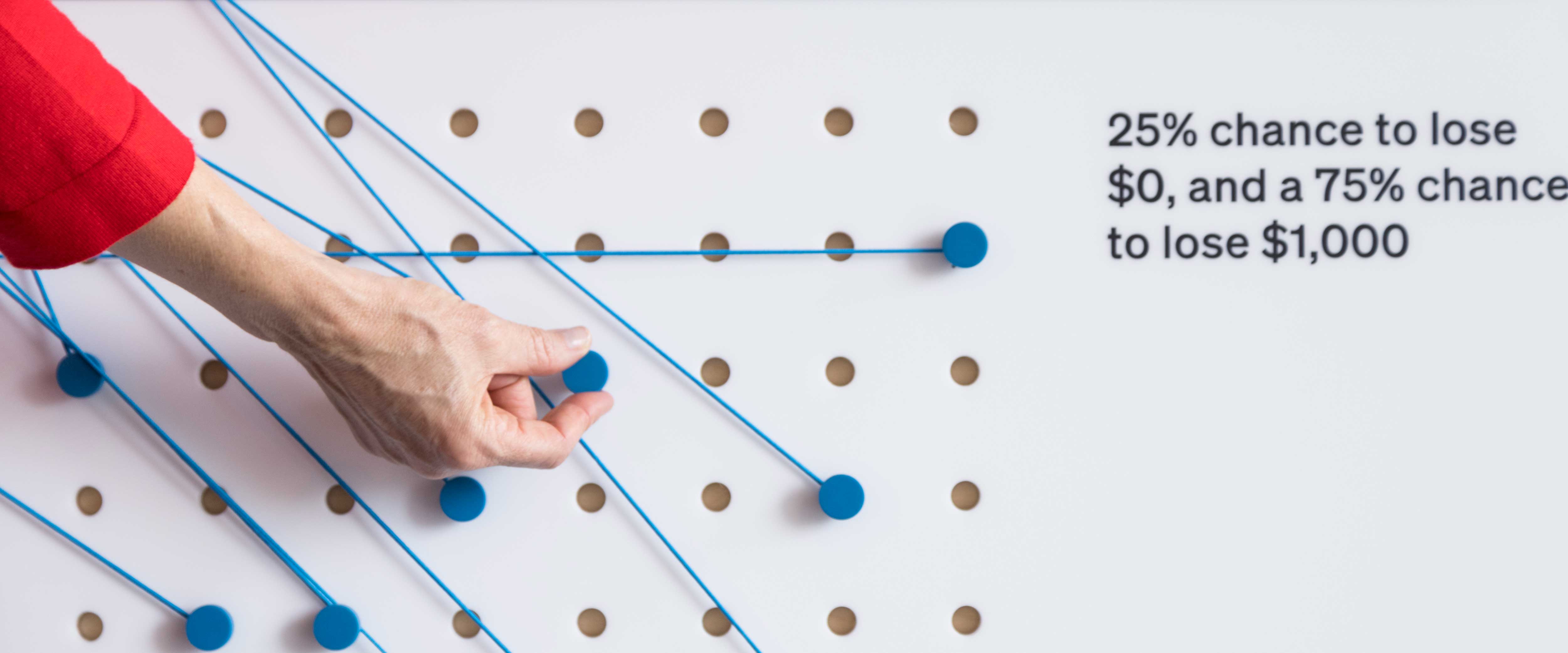 Closeup of a hand moving a peg