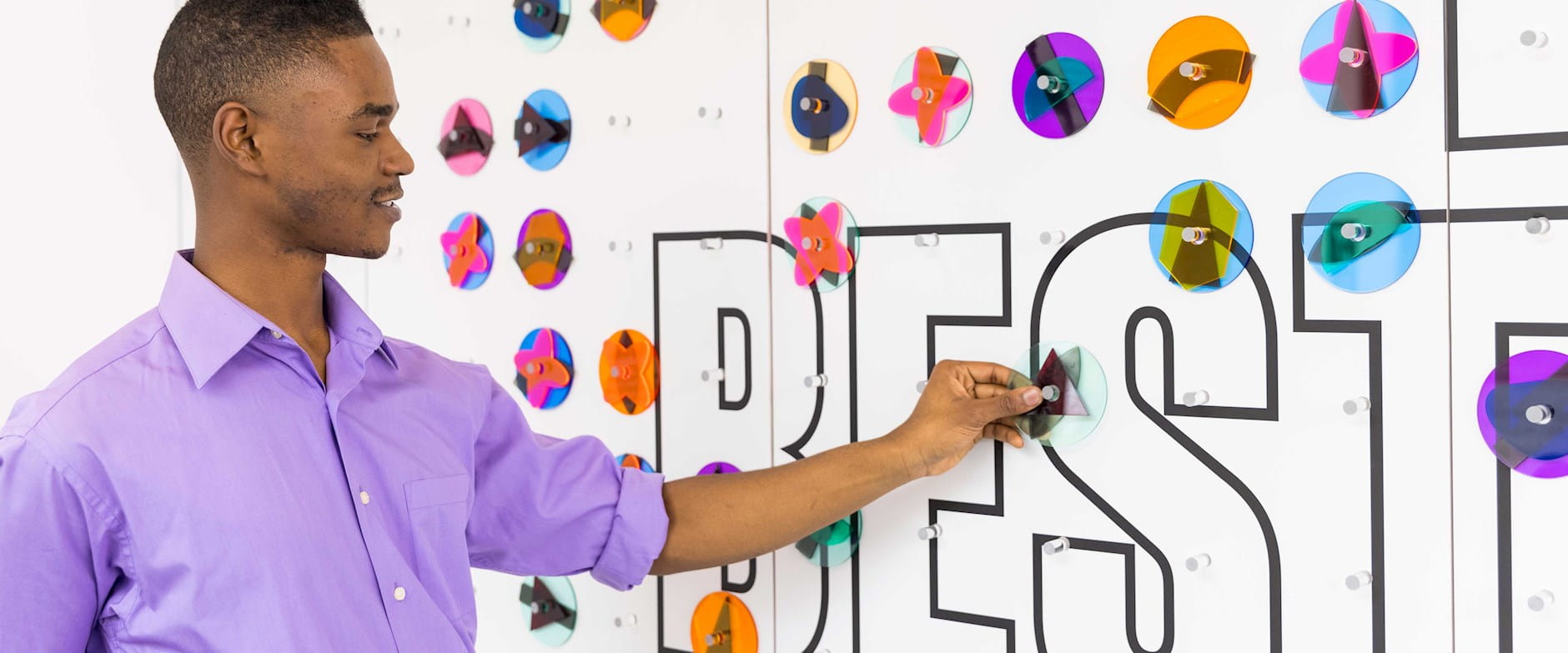 Guest placing shapes on the Design Your Best Life wall