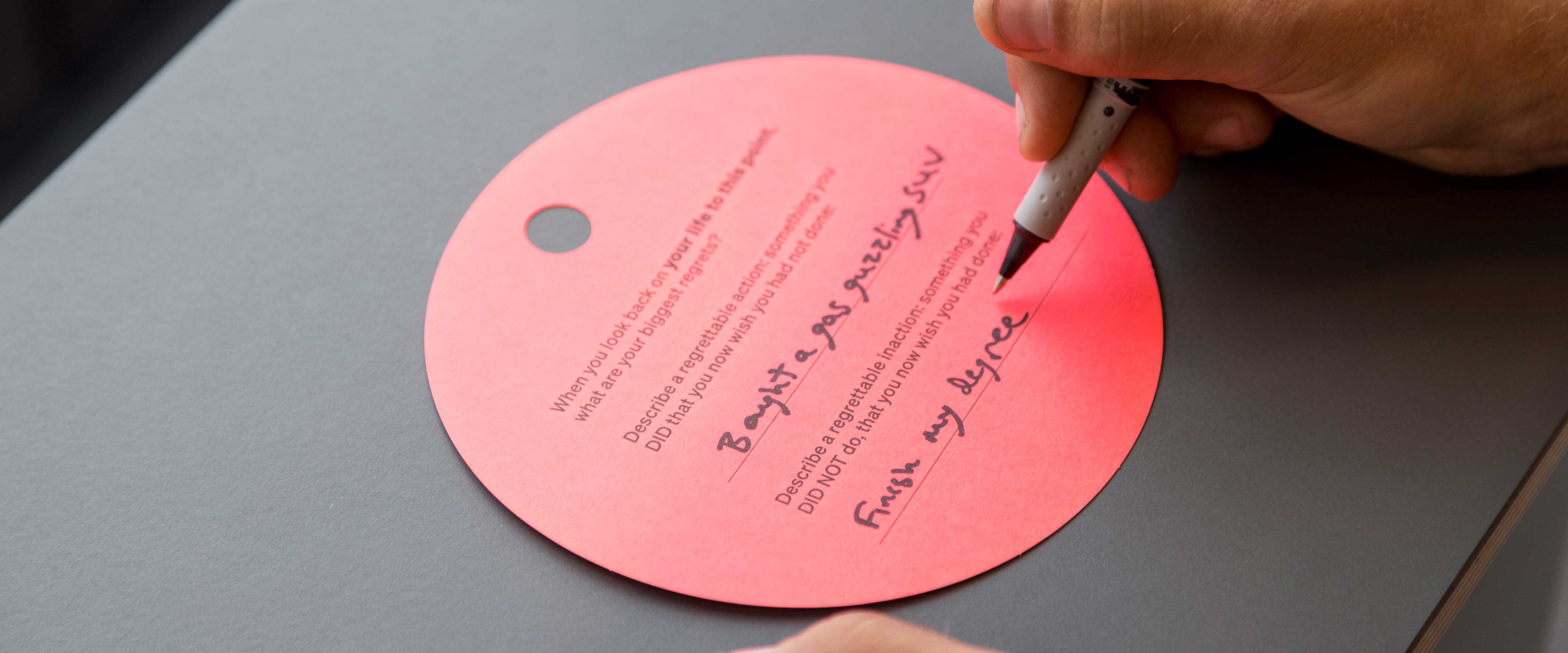 Closeup of someone writing their regrets