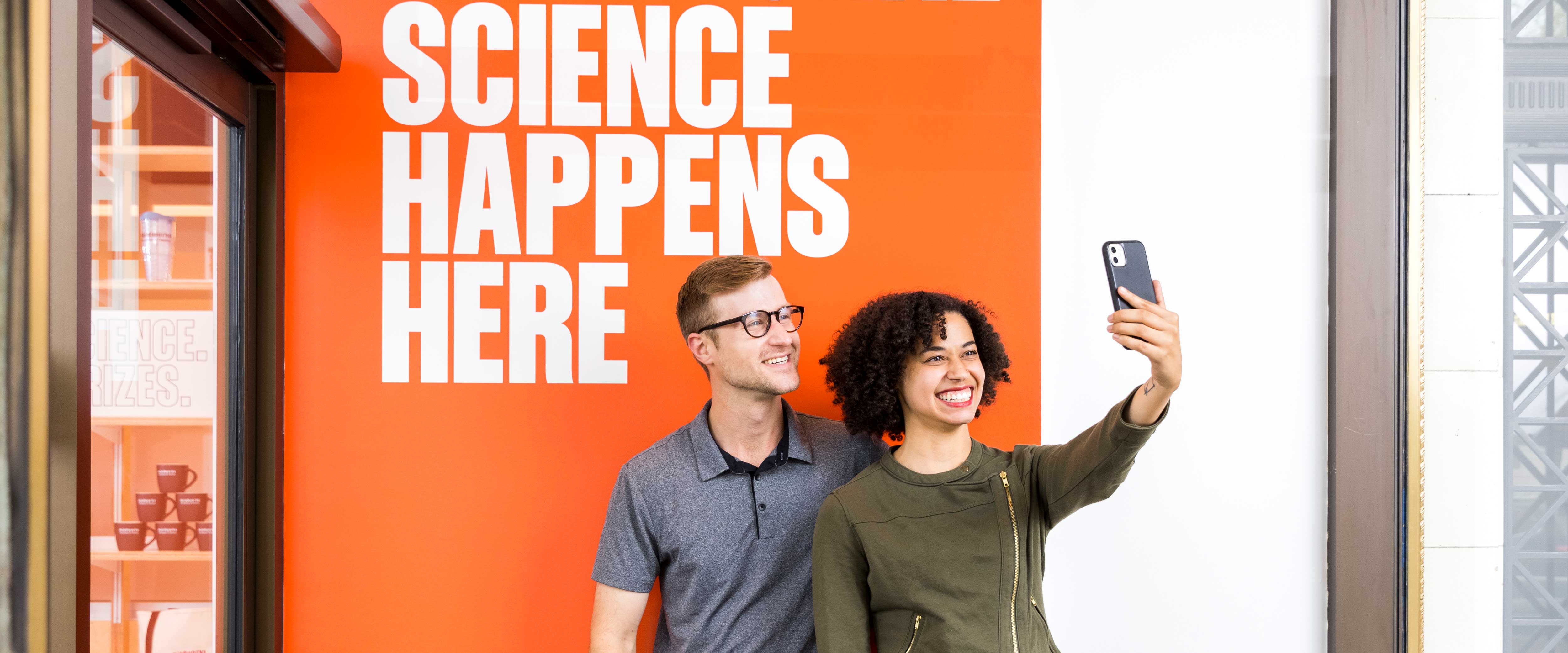 Couple taking a selfie in the Mindworks entrance