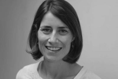 Betsy Cliff smiles in headshot-style photo