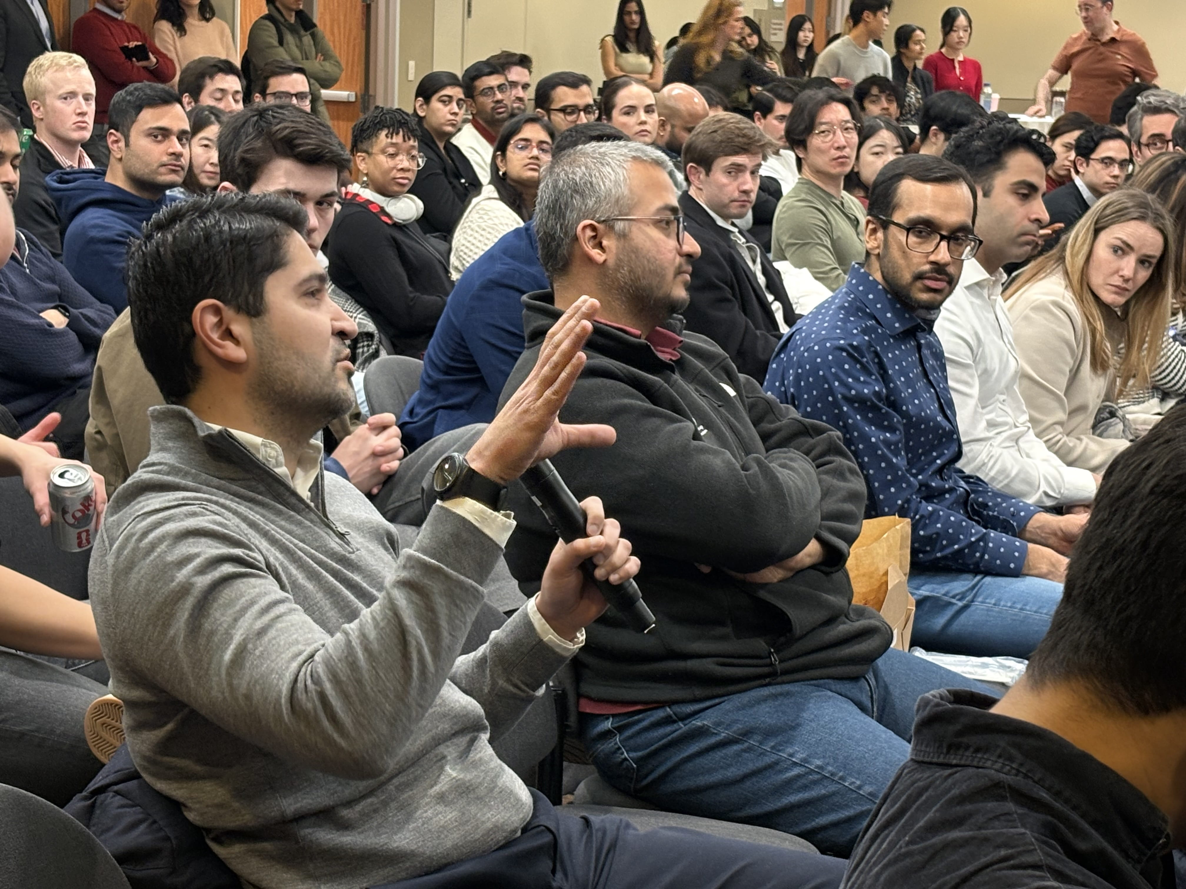 Audience asking questions during Tolan Center Speaker series.