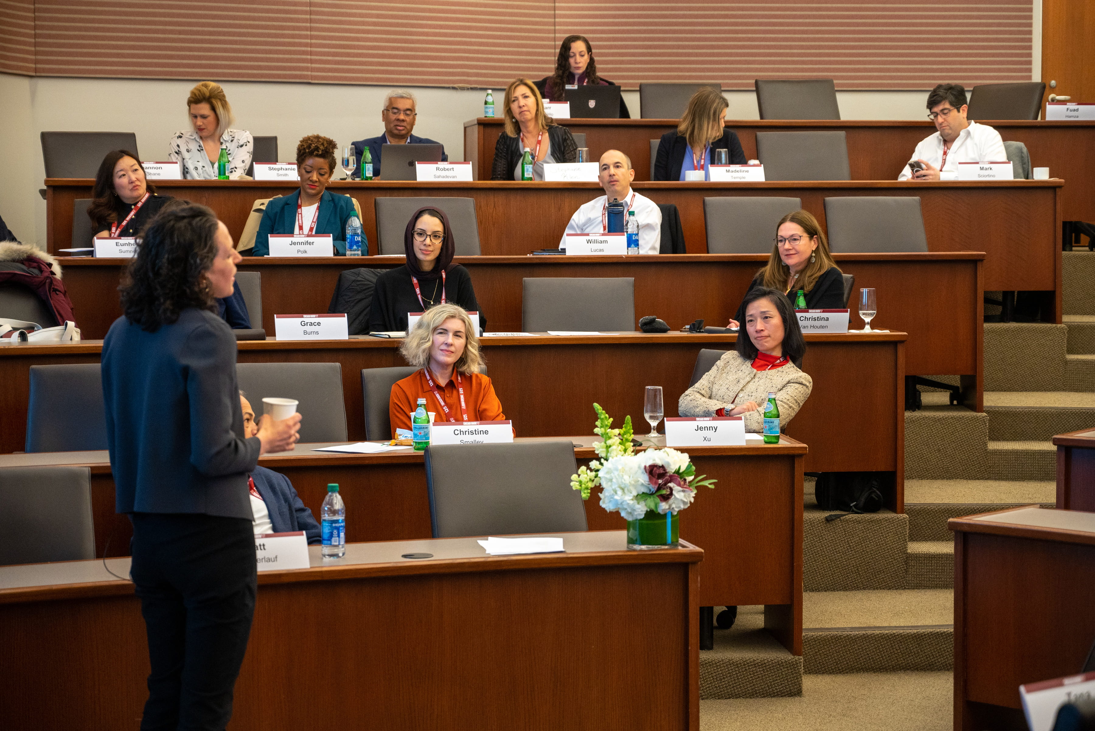 Female speaking to an audience in an auditorium