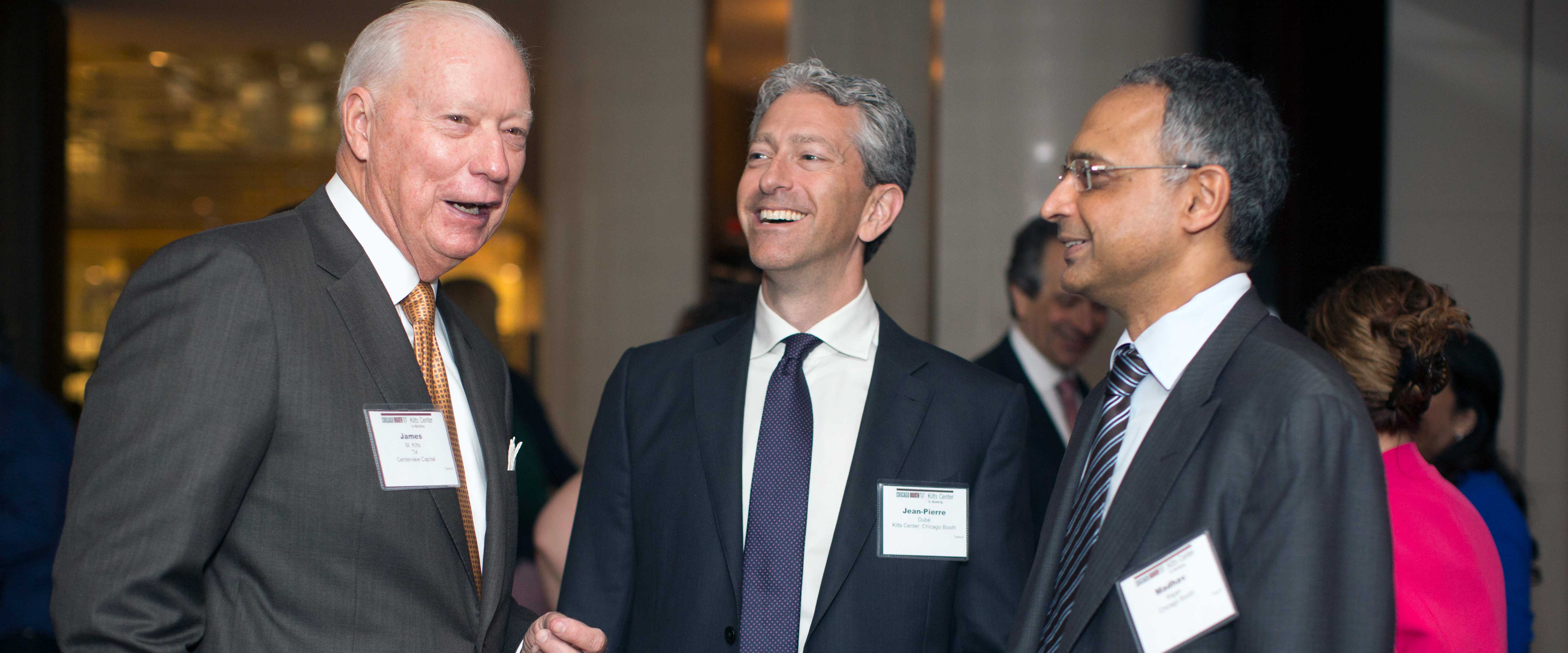 James Kilts, JP Dube and Madhav Rajan talking