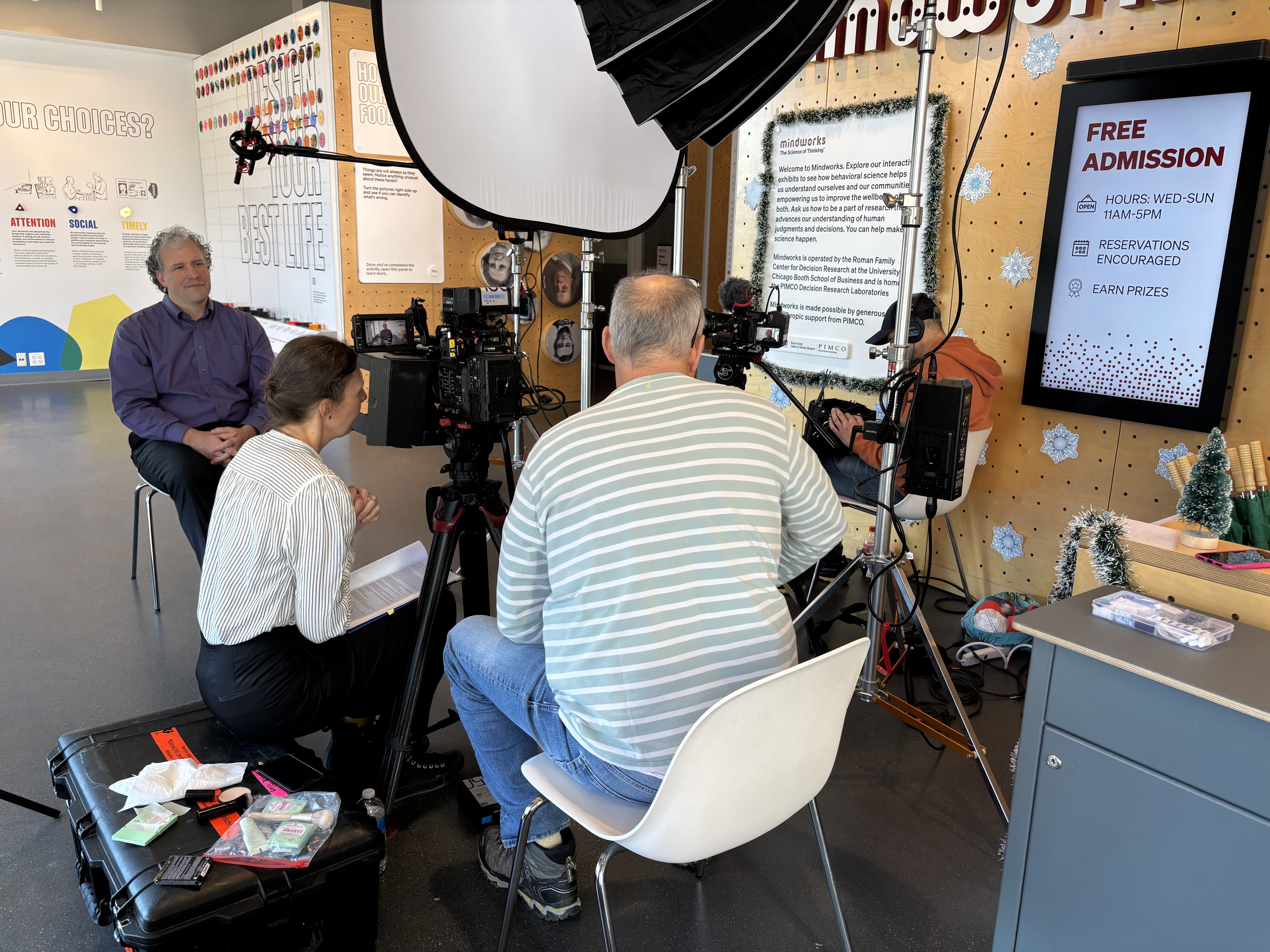 Nick Epley being interviewed by a camera crew