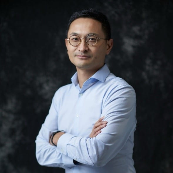 Man looking at camera with his arms folded