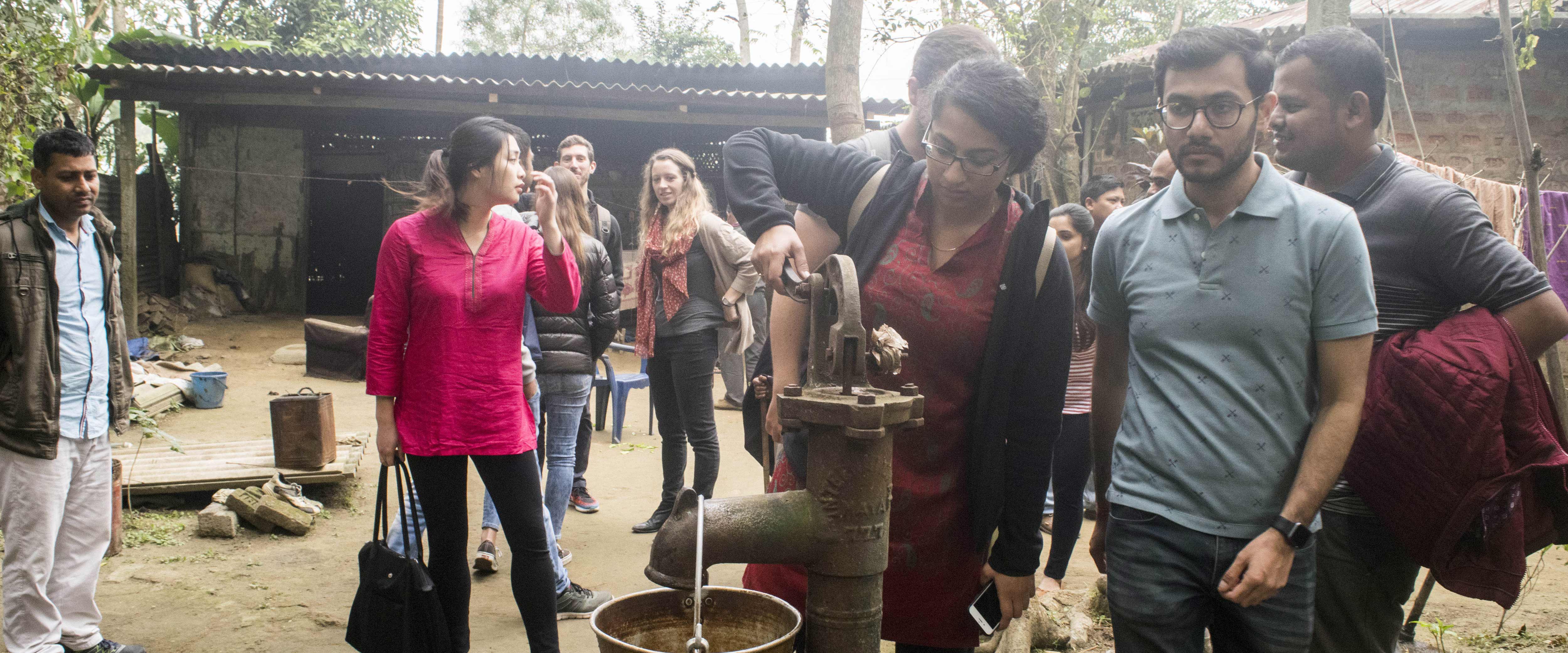 People stand around a well during GSIP India in 2018