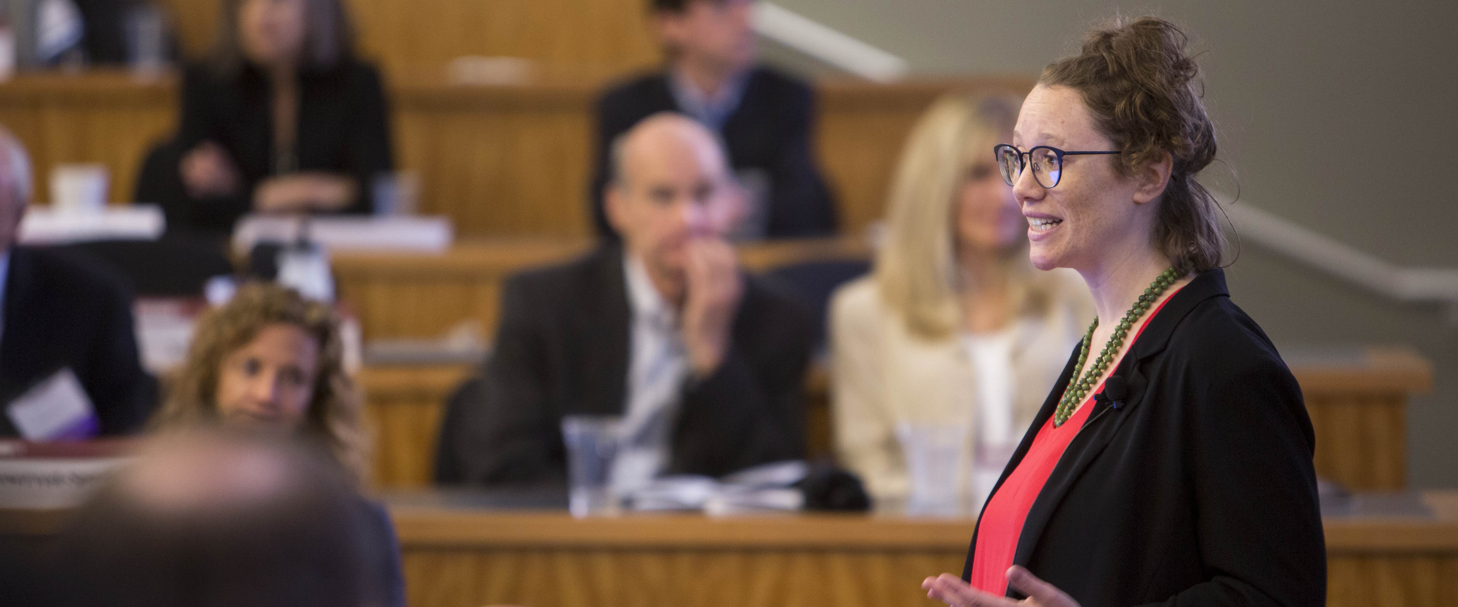 A presenter at SNVC presenting to an audience in a classroom