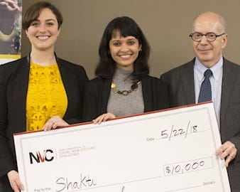 Shakti co-founders holding their giant check at SNVC 2018
