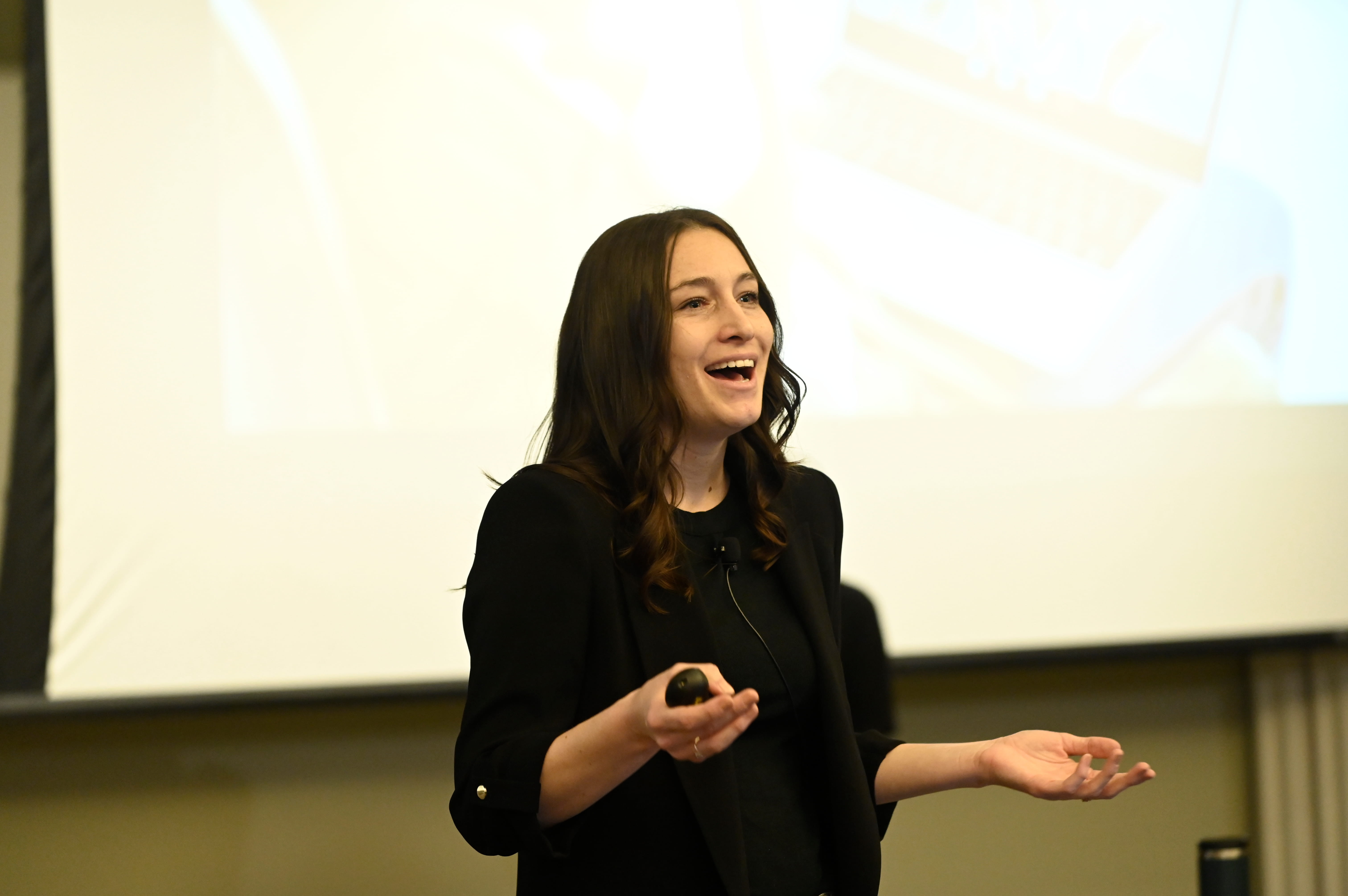 Woman speaking at the front of a classroom