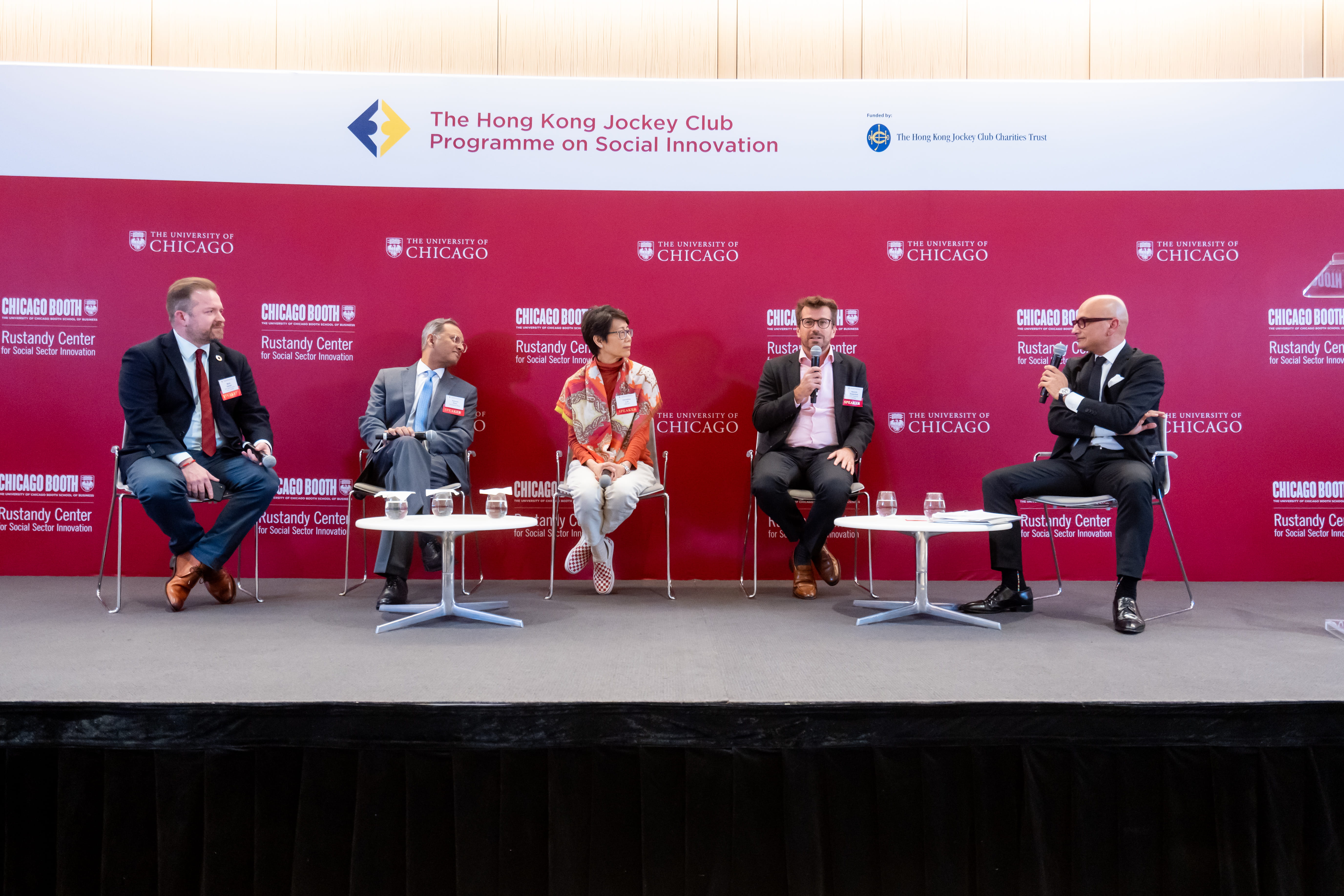 Five people engage in a panel discussion.