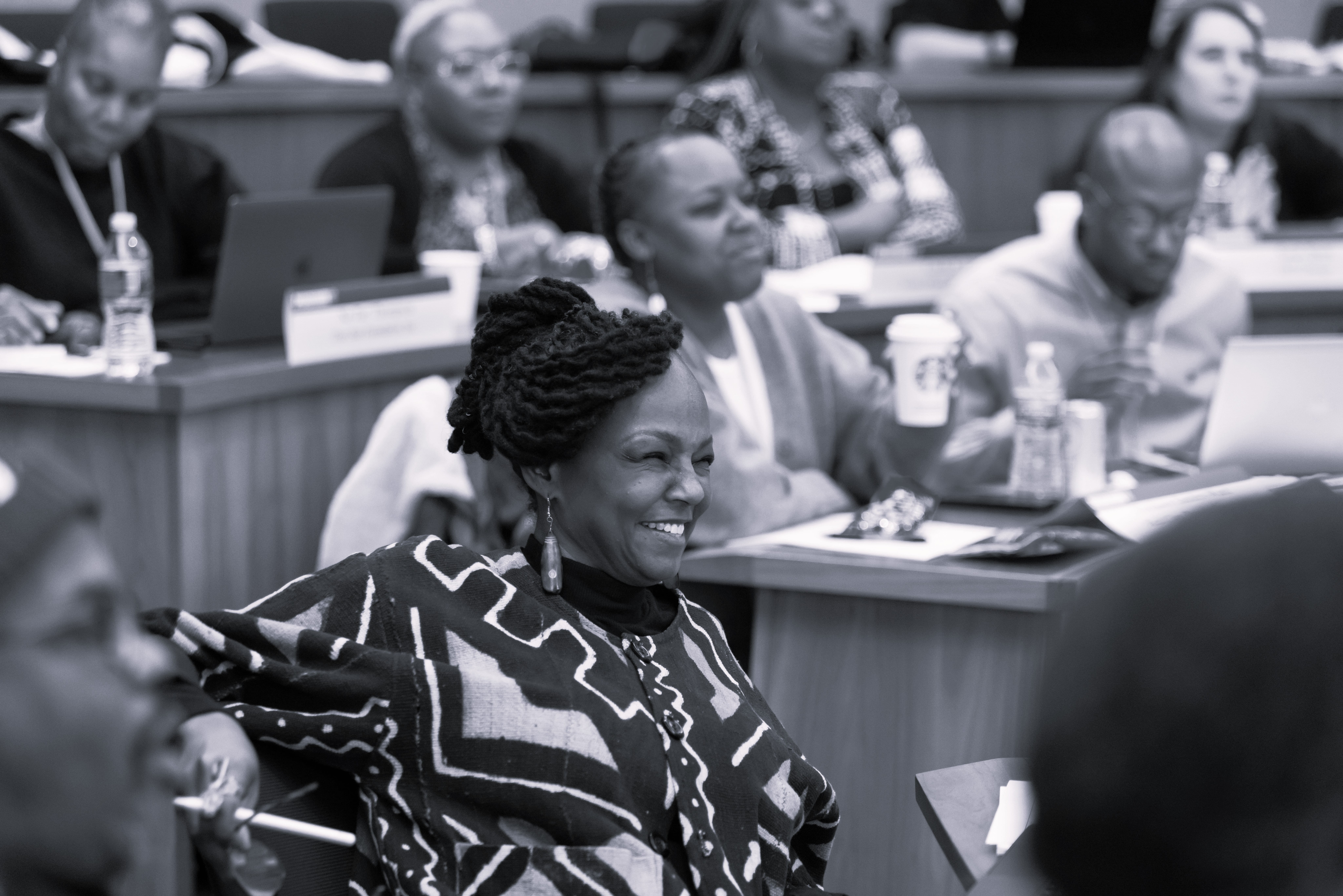 Black woman participating in IGNITE smiling in classroom