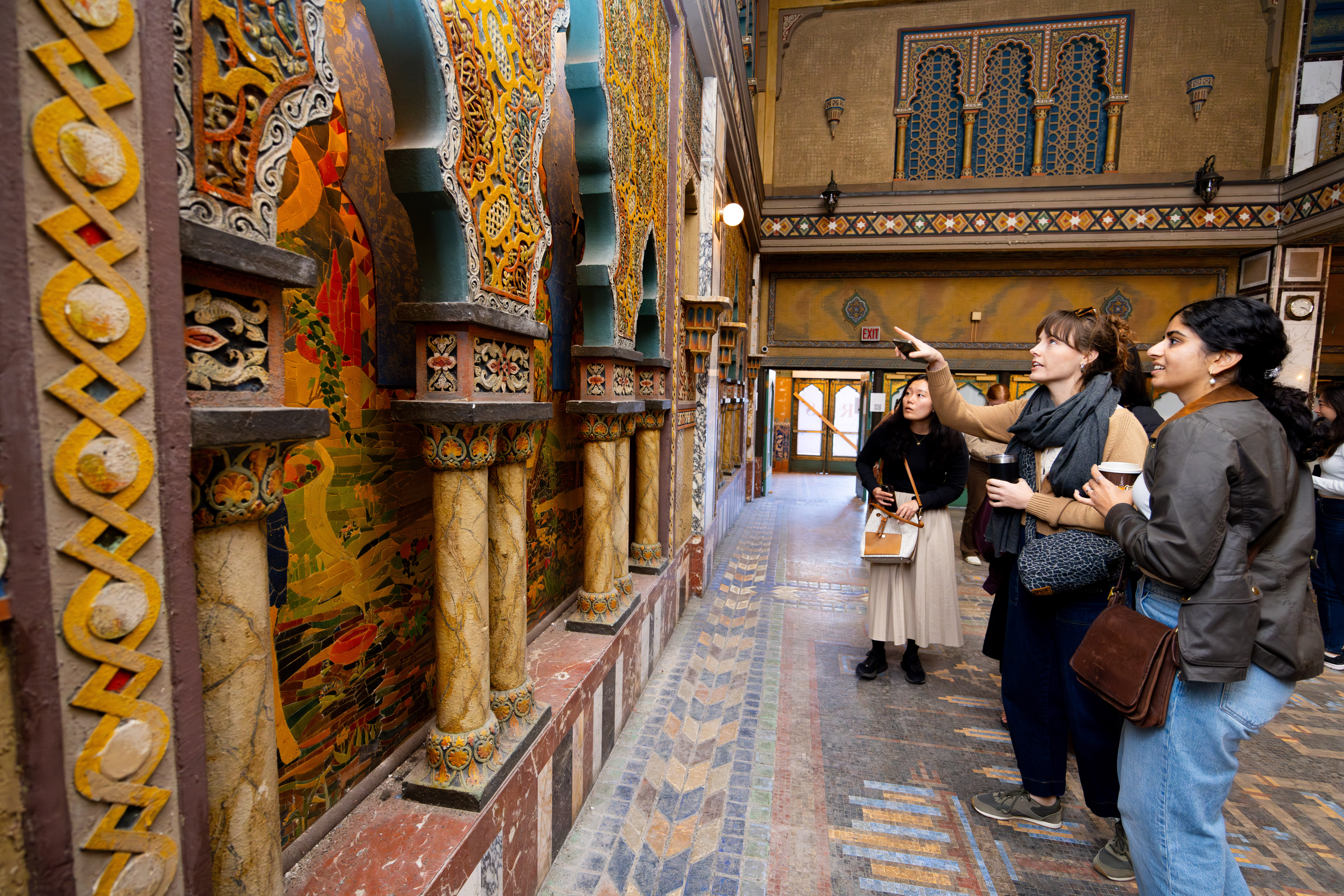 Booth students observing art