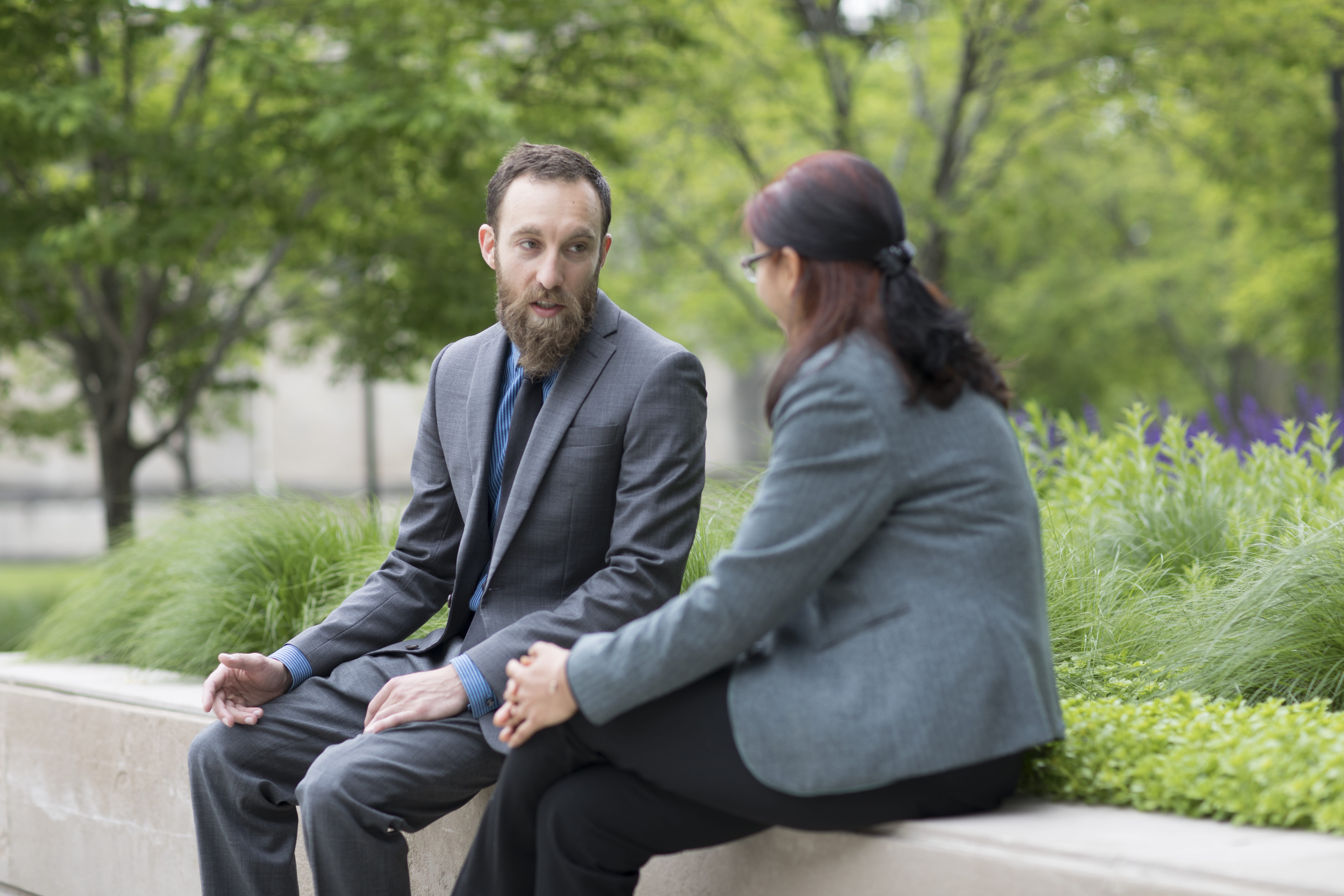 Two students in conversation outdoors