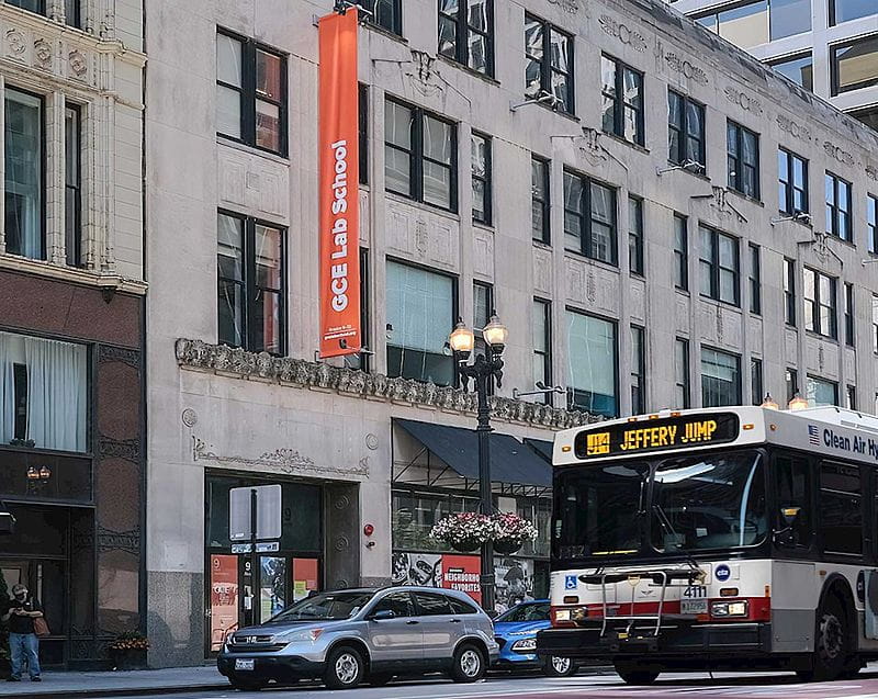 Busy street in city with bus and SUV in Chicago