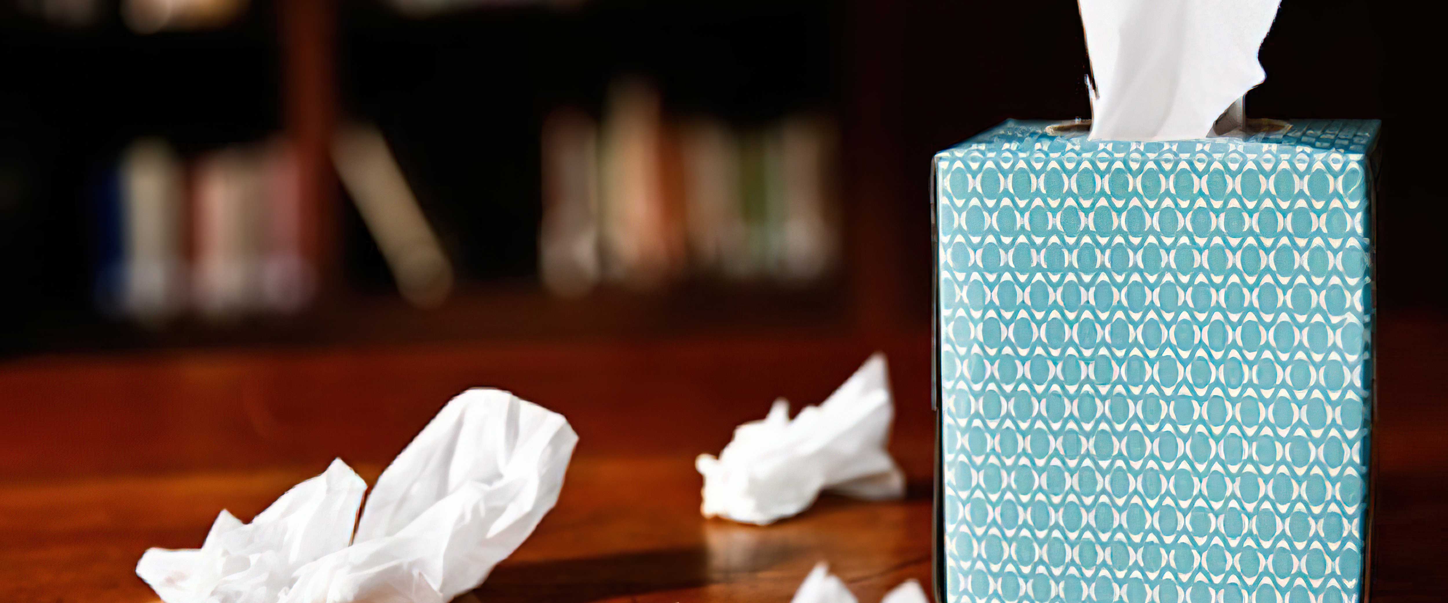 Used tissues next to tissue box
