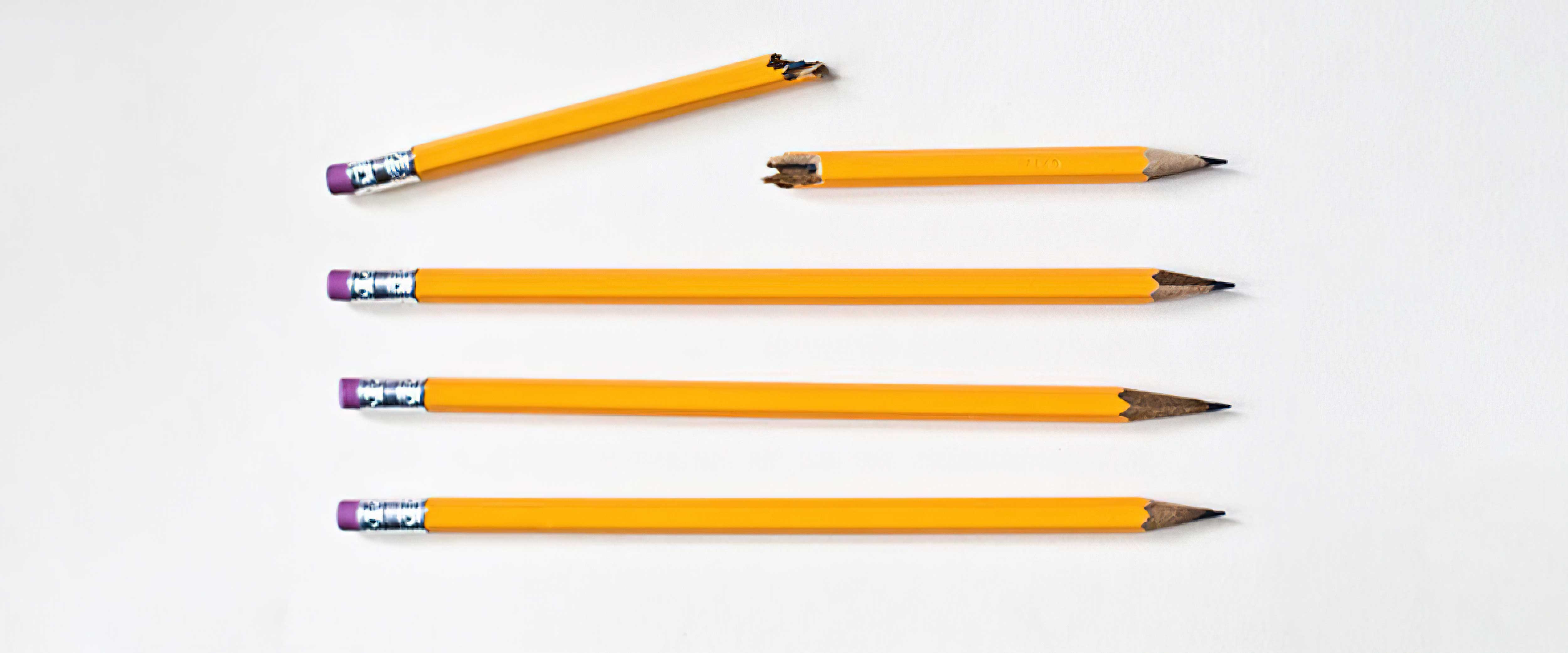 Four pencils with one cracked and broken