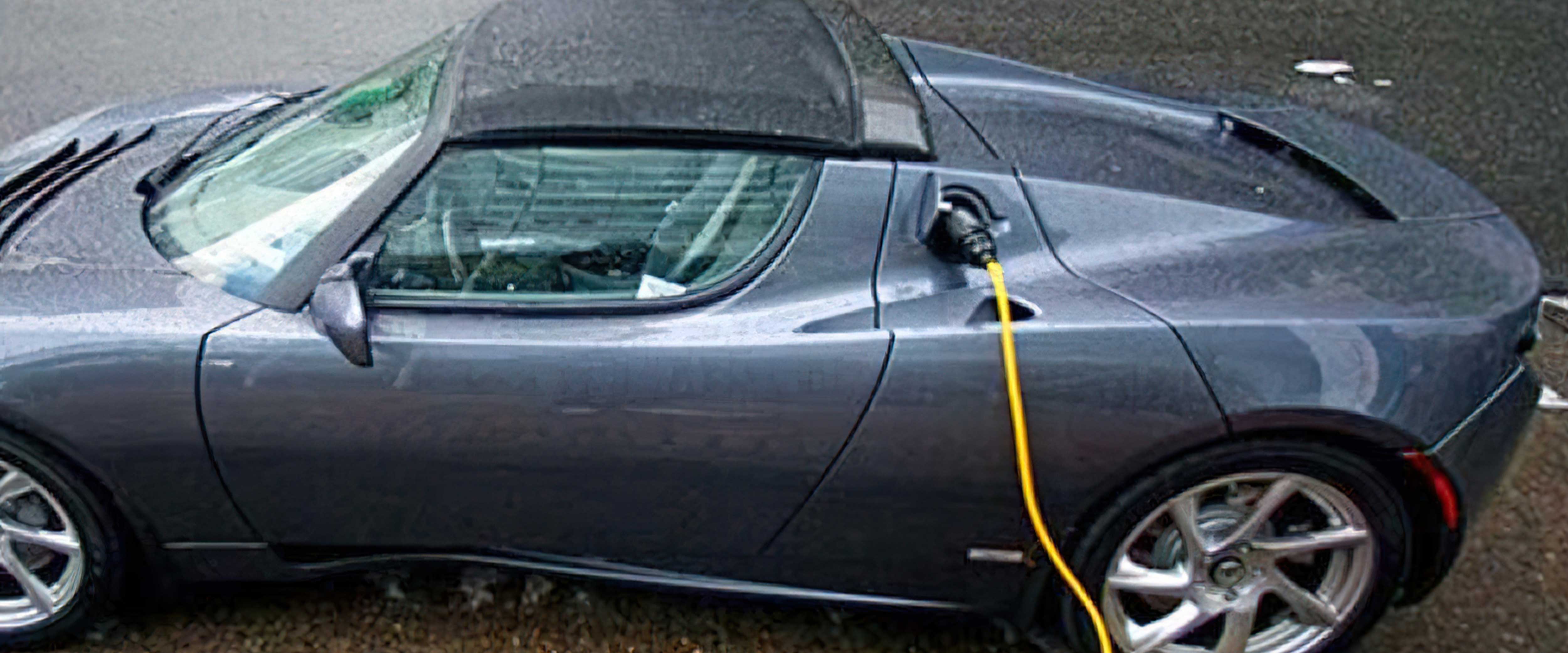 Electric car connected to charger