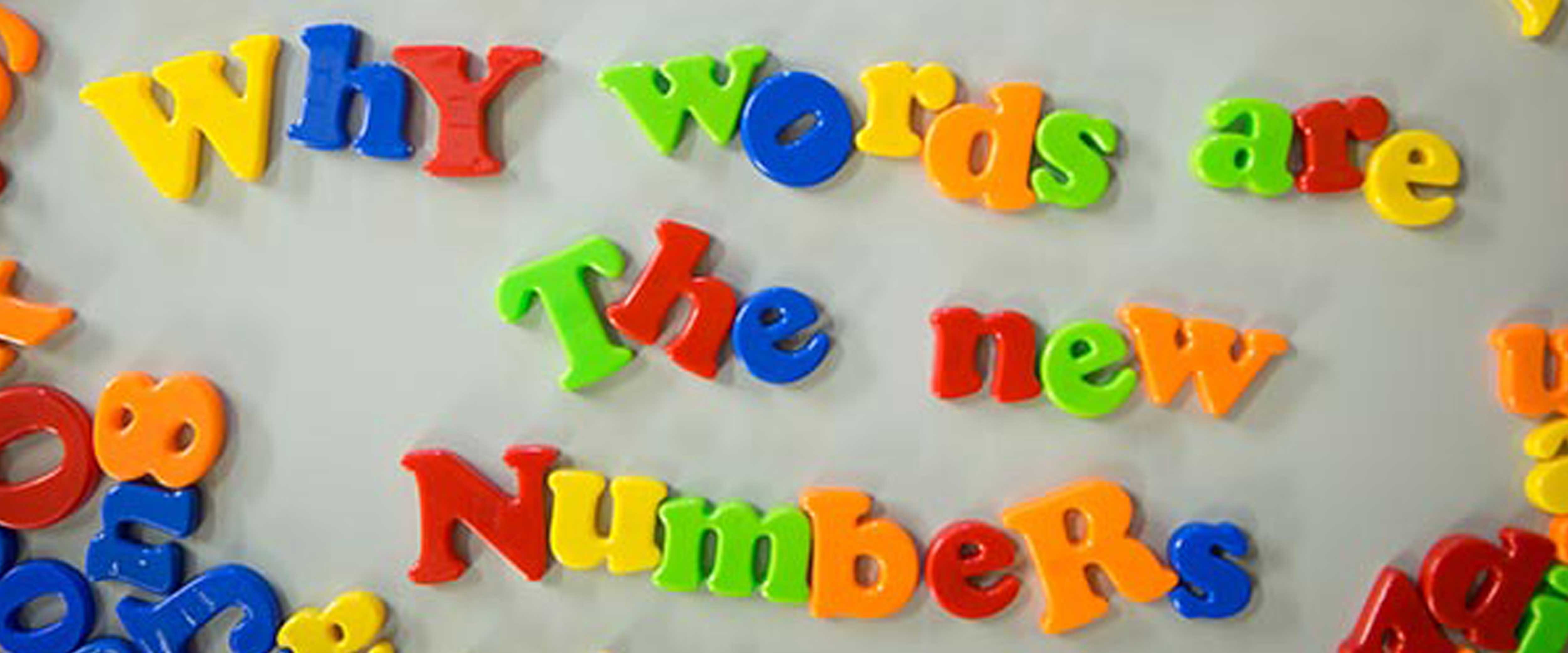 Magnetic letters that spell out "Why words are the new numbers"