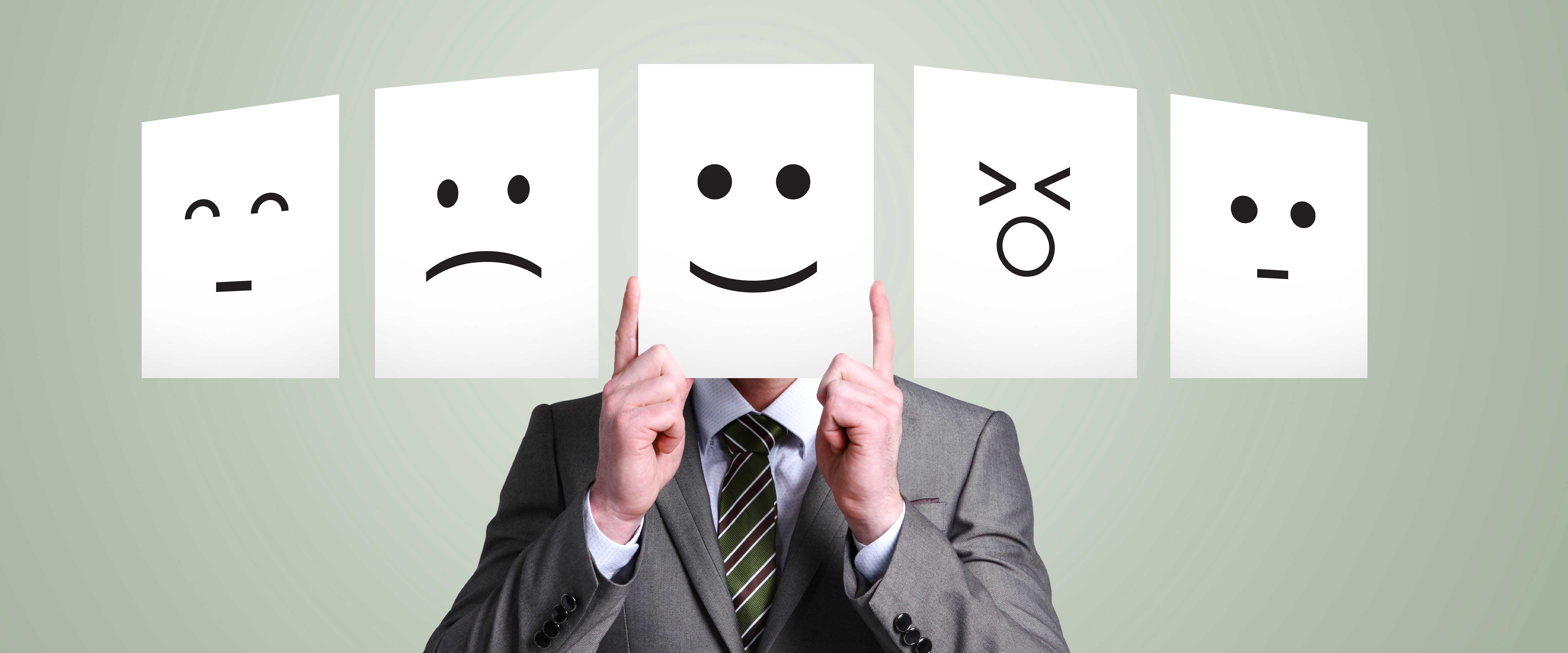 Person holding up papers with different facial reactions