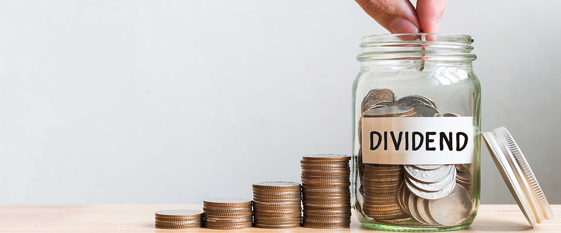 Money jar labeled "dividend"