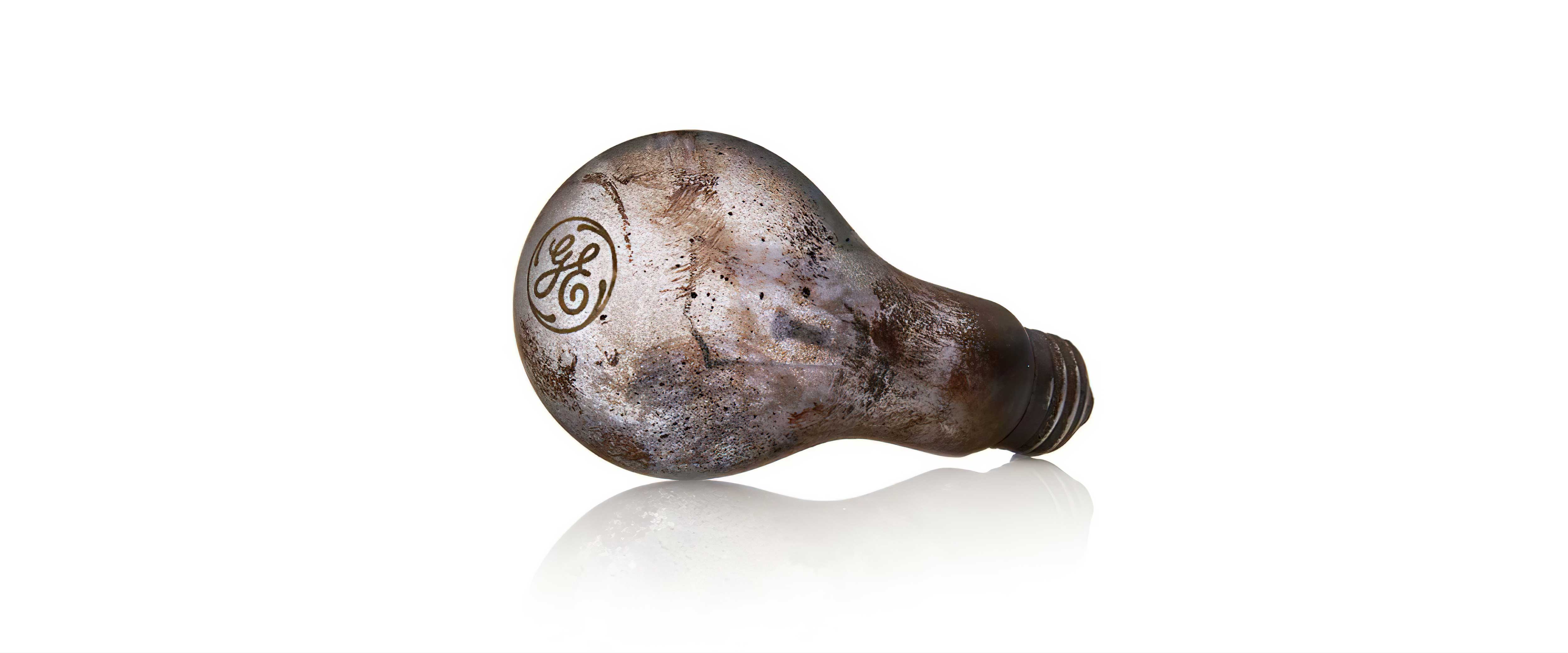 Dirty lightbulb resting on its side