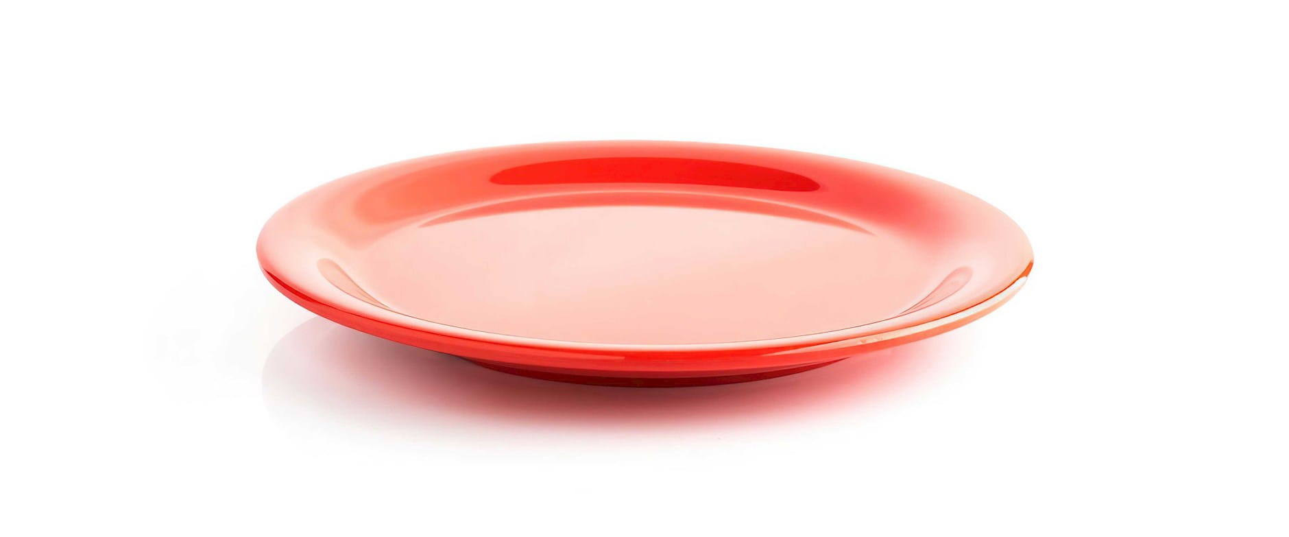 Red plate on a white surface