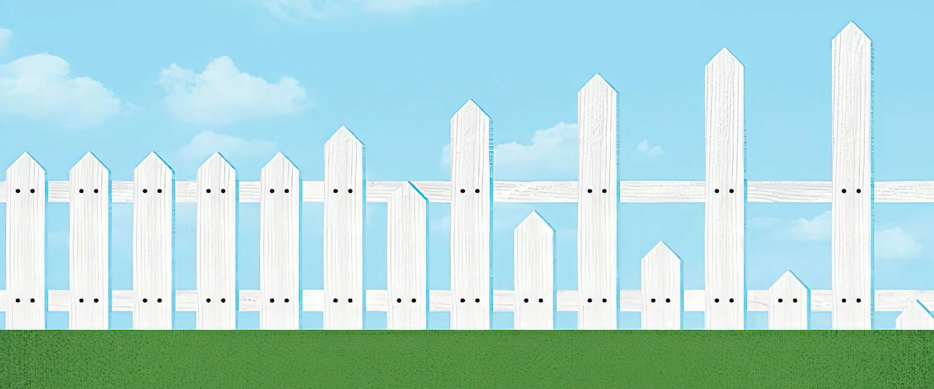White picket fence with slats of different sizes at the end