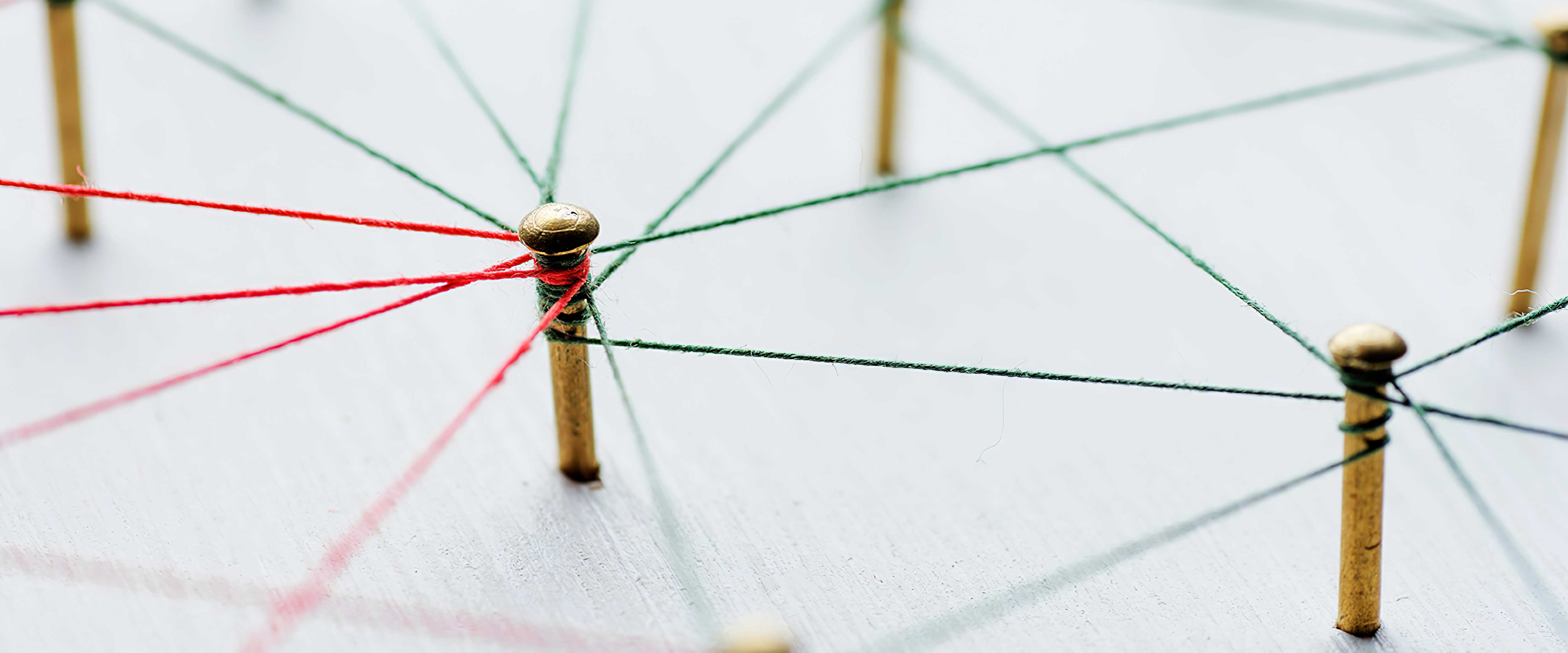 Pegs connected by strings to form a pattern