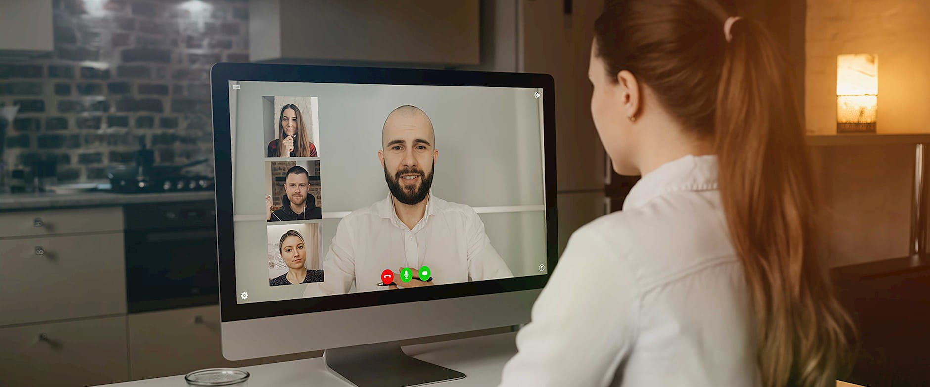 Woman at a computer in a zoom meeting
