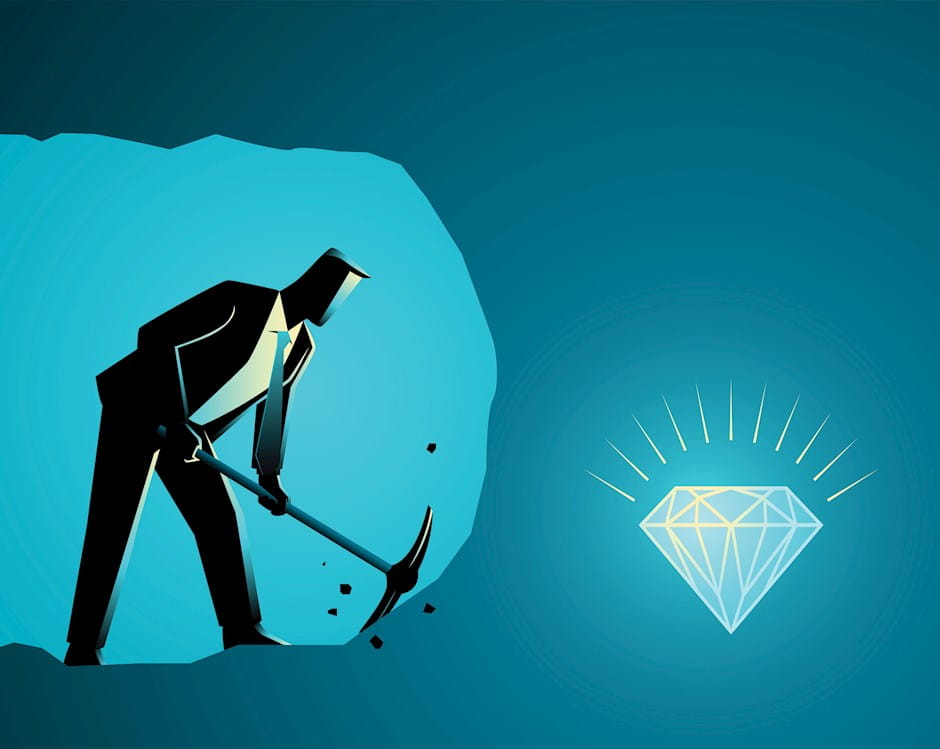 Businessman digging in a diamond mine