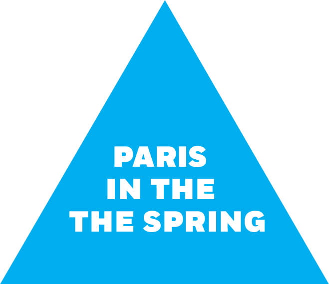 Blue triangle with the words "PARIS / IN THE / THE SPRING"