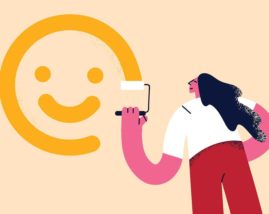 Woman painting smiley face