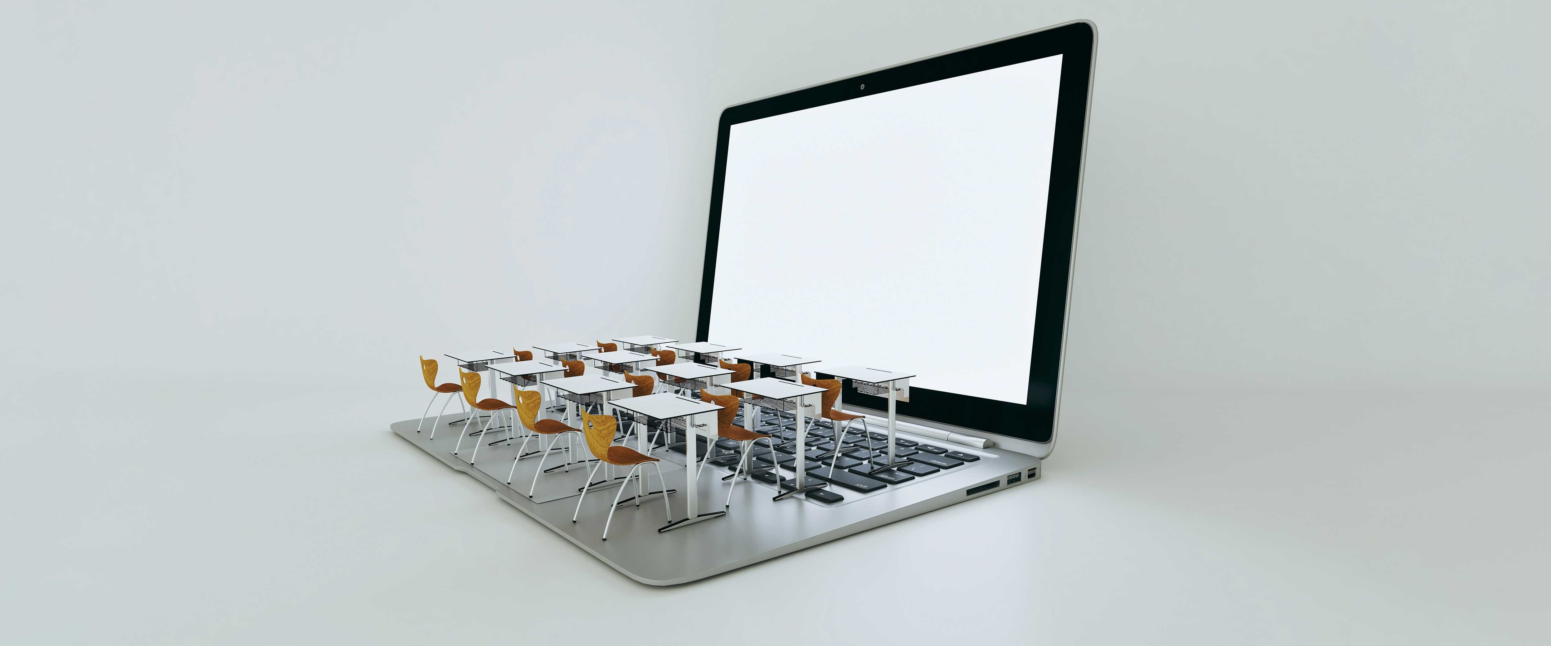 School desks on laptop keyboard