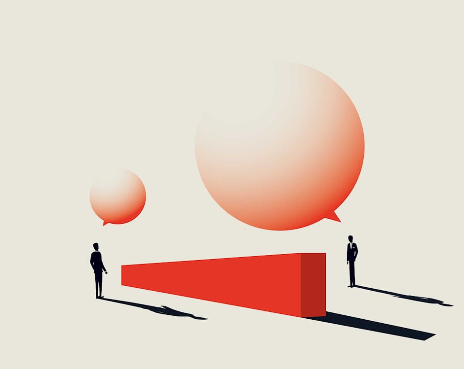 Two men talking over a wall