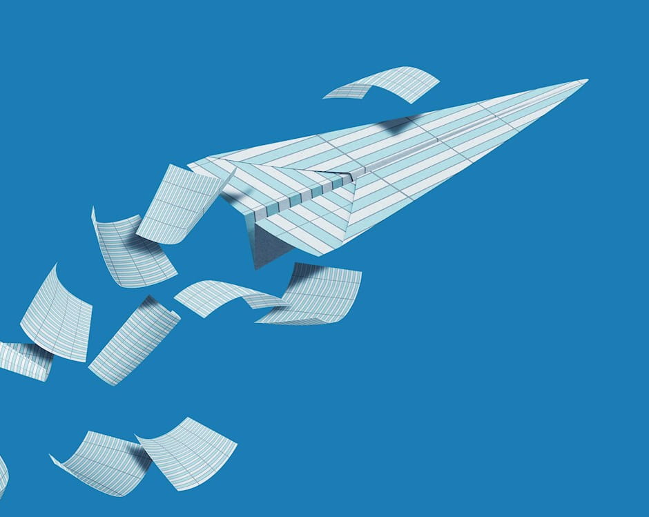 Paper airplane made from accounting ledger