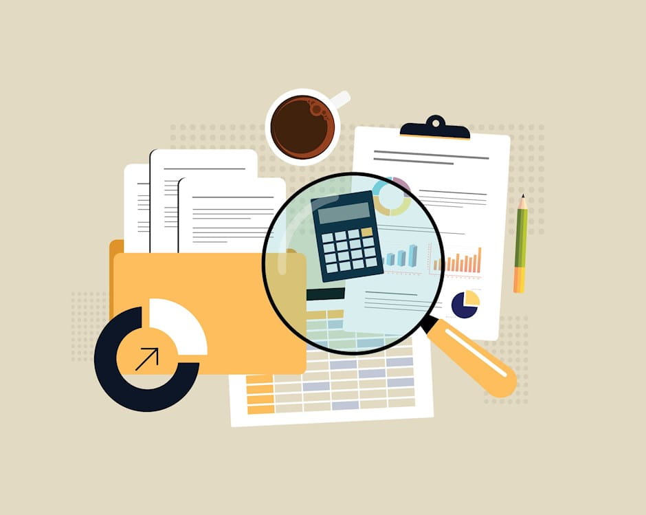 Financial documents and magnifying glass