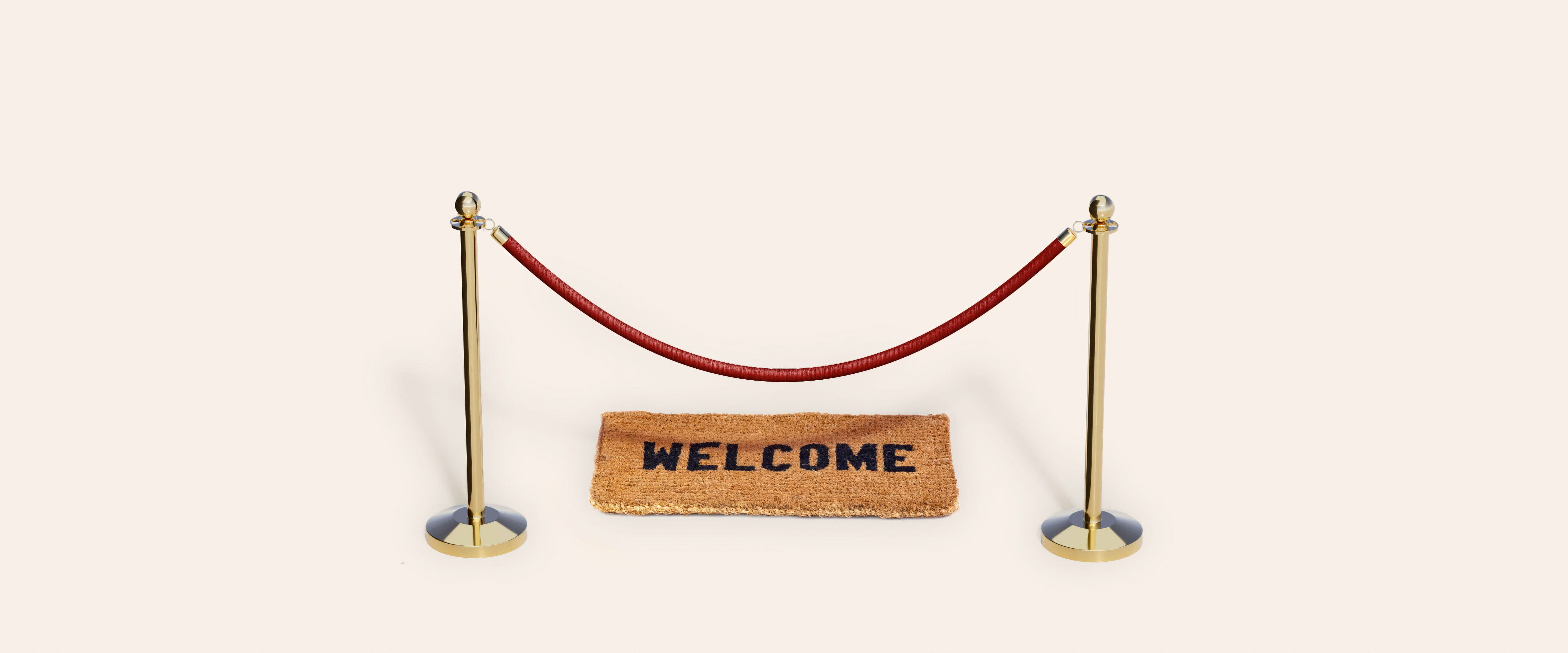 Welcome mat behind a velvet rope