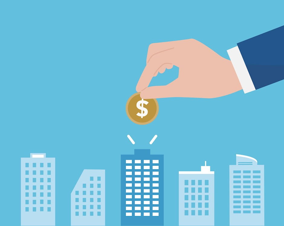 Hand putting coin in office building