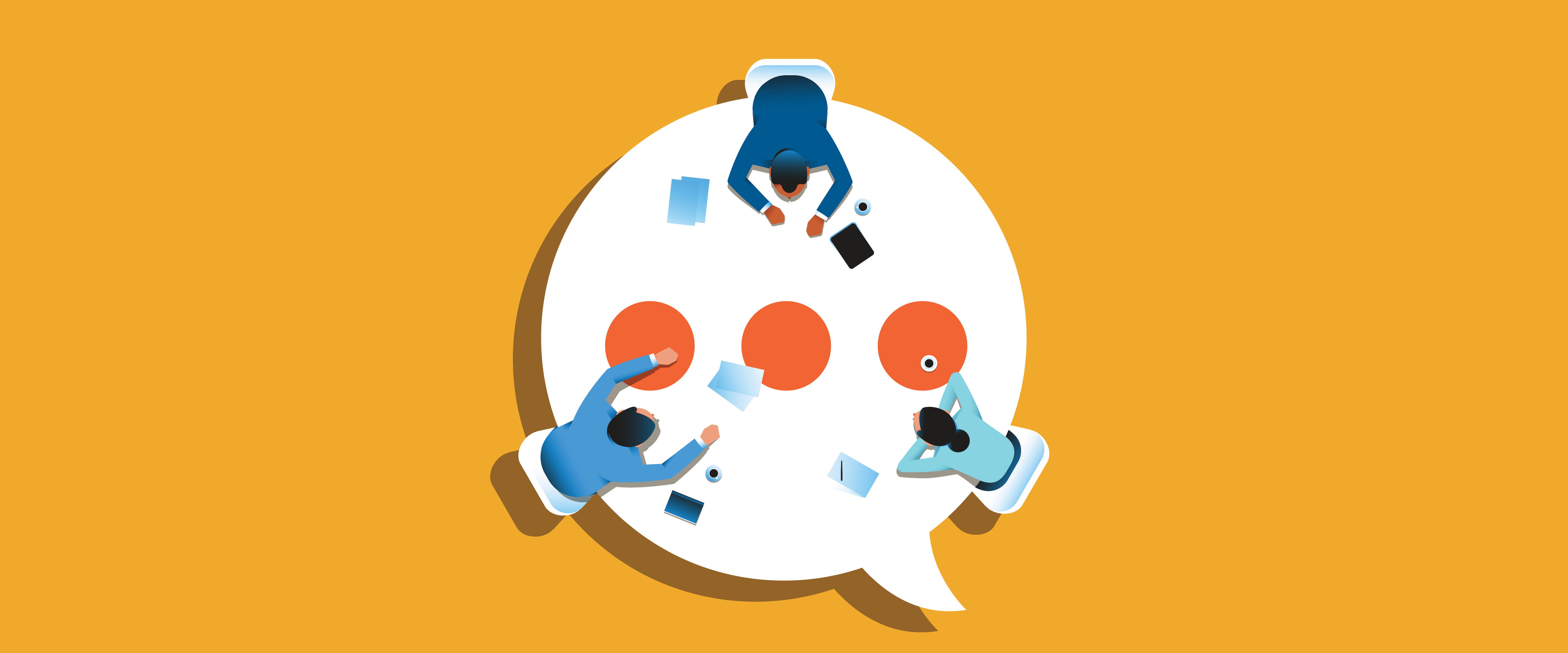 Coworkers around a table that is also a speech bubble