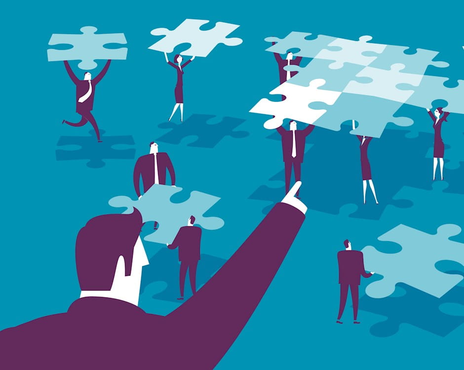 Man telling people where to put puzzle pieces