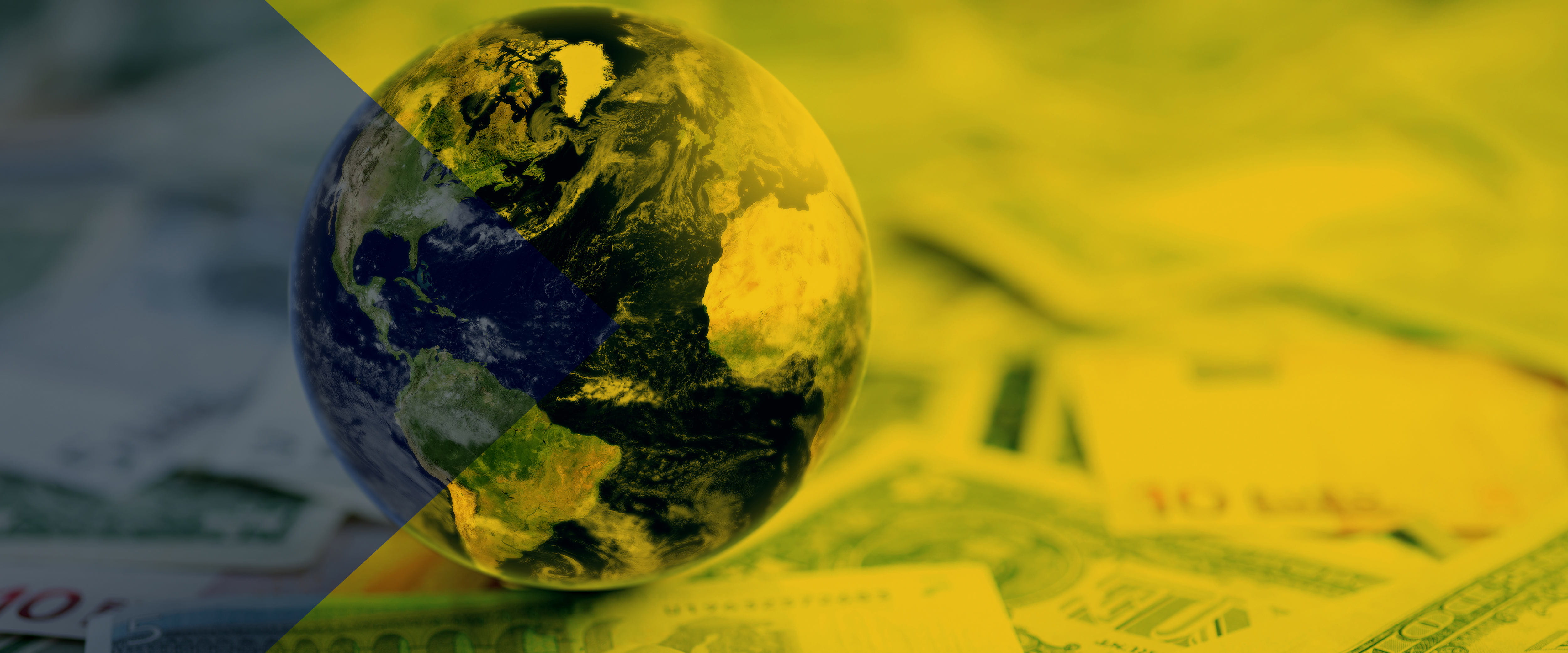 A globe rests on a layer of different international currencies