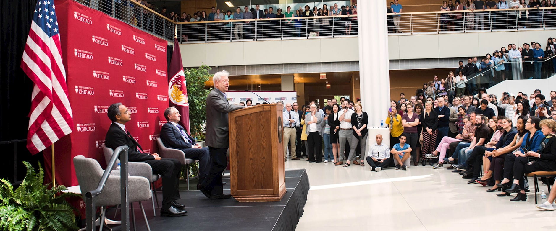 Richard thaler speaking at a podium during his Nobel Prize press conference