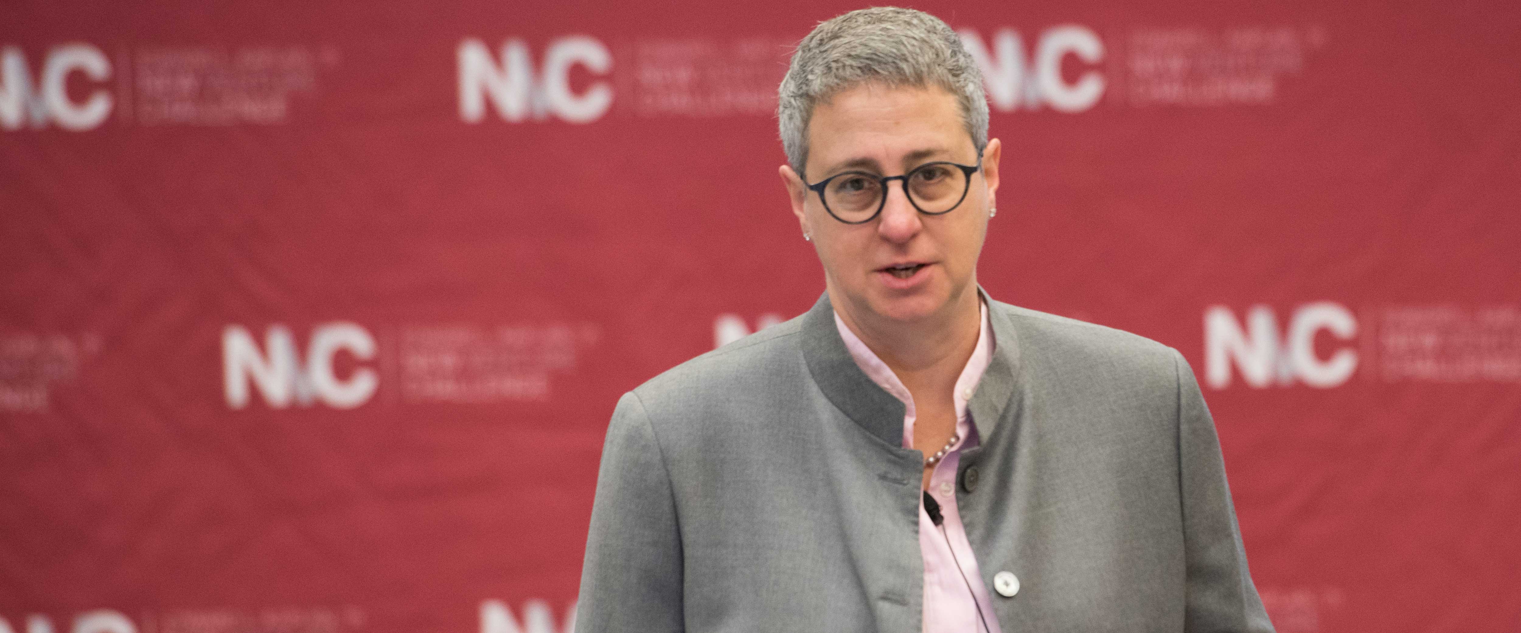 Waverly Deutsch speaking in front of an NVC backdrop