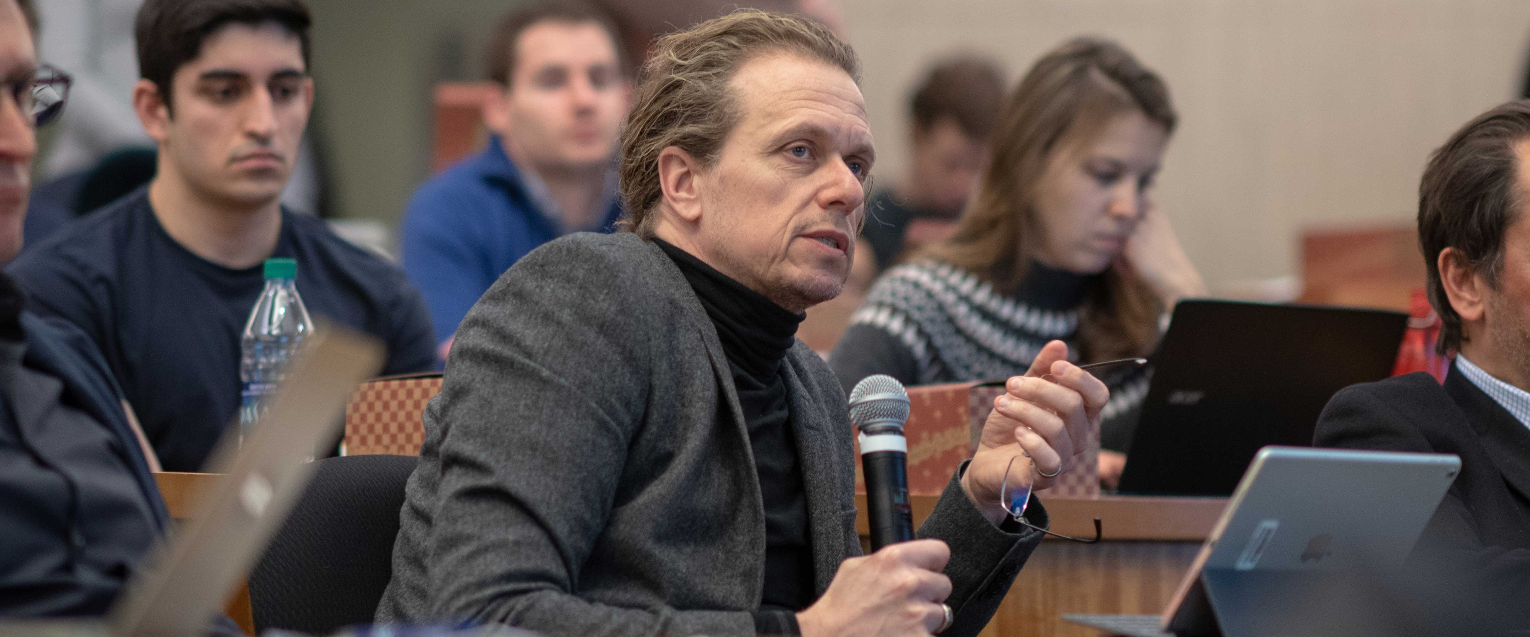 Christian Leuz speaking on the dias