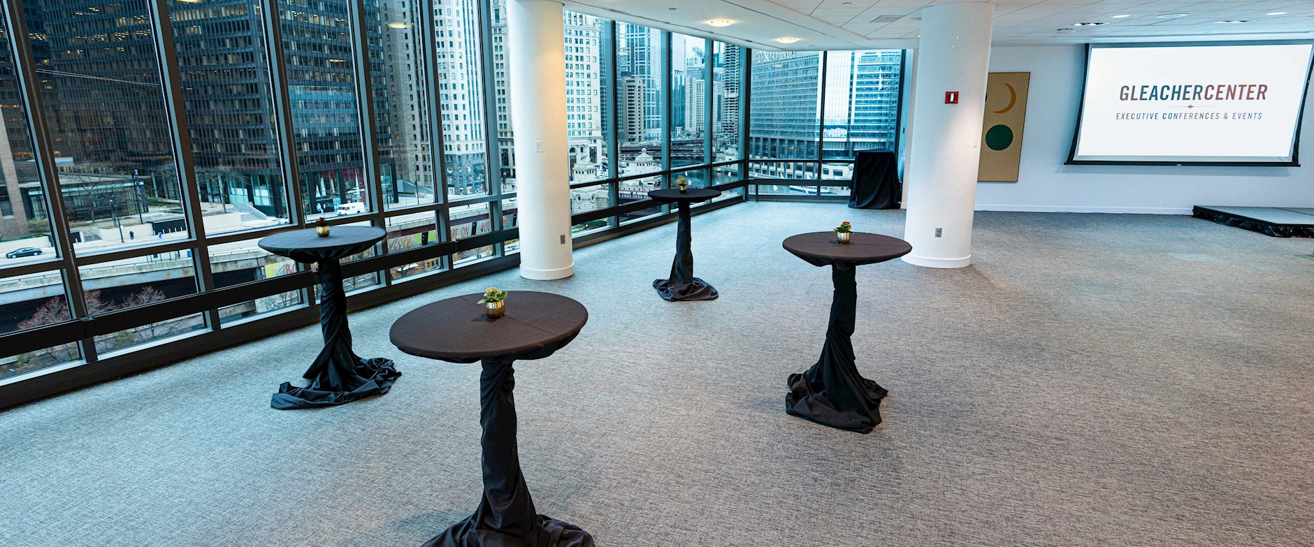 Gleacher Center conference area and cocktail tables overlooking the Chicago River