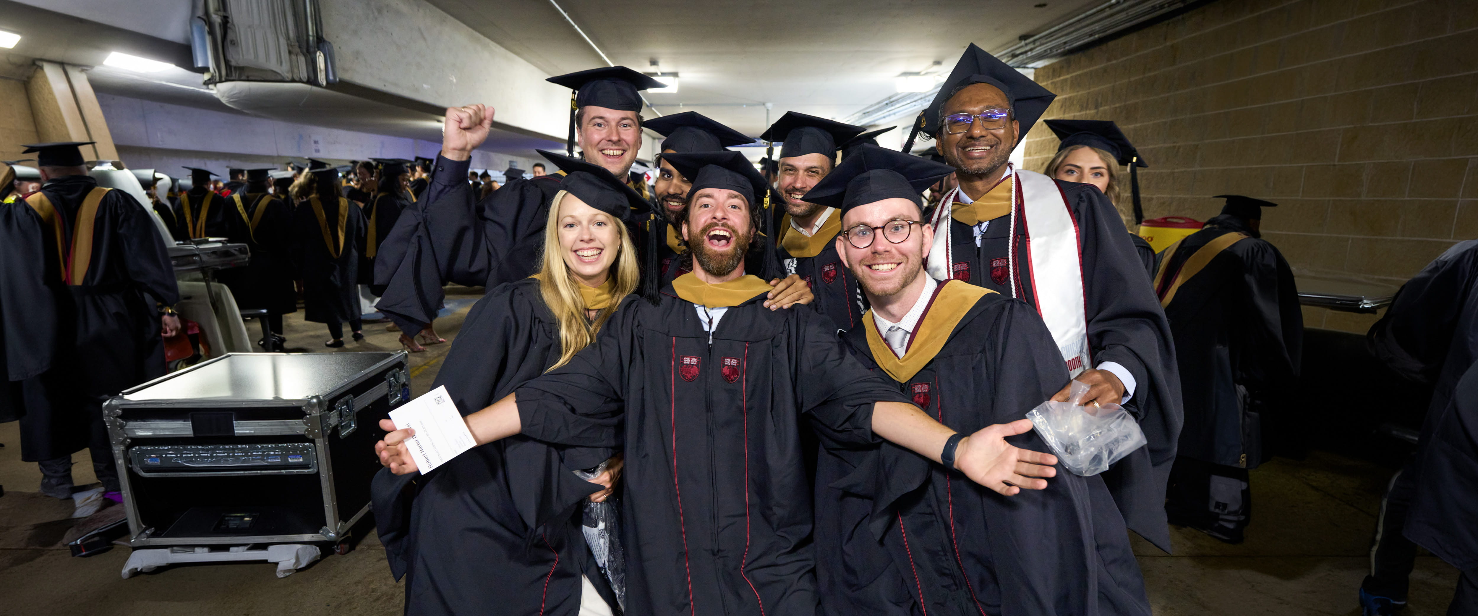 A group of Booth students celebrating at the graduation ceremony.