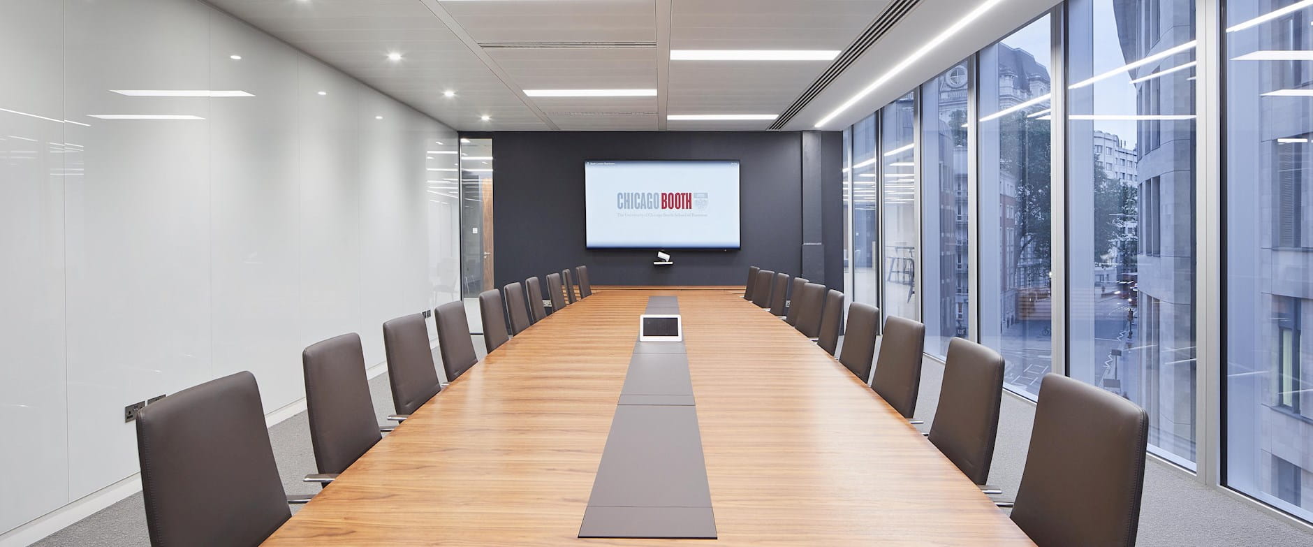  A conference room with audiovisual equipment such as a television and an iPad